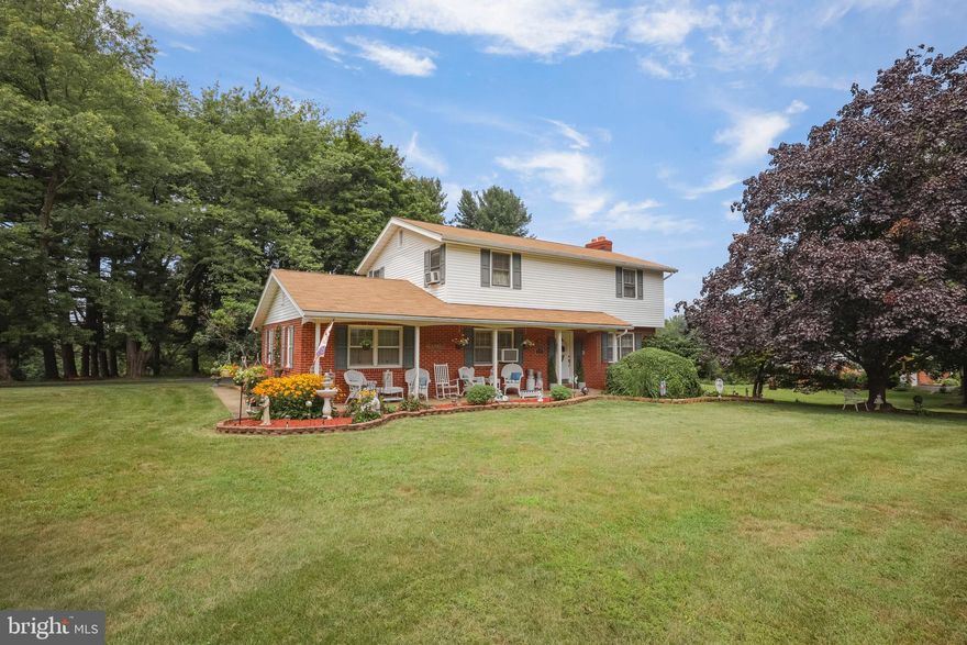Porch front colonial with updated mechanicals and great schools! This well maintained home has 4 bedrooms, 1.5 baths, and hardwood floors throughout. The large lot offers plenty of room for entertaining.  2018-2019 the seller installed a new roof, chimney cap, water heater, front and back doors, driveway, boiler, and septic tank. 2021 the basement was completely gutted, freshly painted, and a new exterior door installed. This home has been well loved by the owners. Move in now and make it your own! The possibilities are endless. The home is being sold as-is.