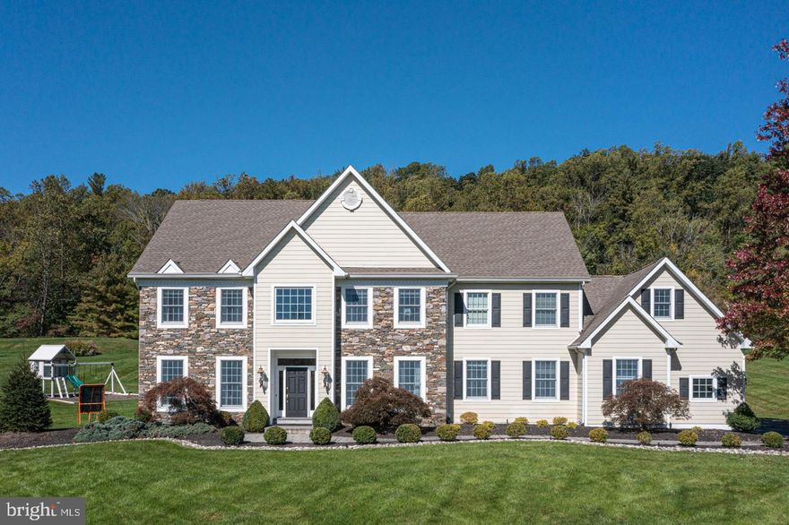 For those in search of space and splendor, your new home awaits. Resting on nearly 2 acres on a quiet cul-de-sac is this impressive stone front colonial located in the sought-after neighborhood of Bowman's Tower Farm. The open floor plan allows light to naturally stream throughout this beauty, starting with the 2-story foyer that is exposed to both the formal living and dining rooms and to the centrally positioned turned staircase at the heart of the home. The great room showcases a spectacular soaring ceiling along with an abundance of windows and gorgeous floor-to-ceiling stone fireplace making it the perfect family get-together spot. For the chef in the house, is the newer gourmet kitchen boasting striking white cabinets, quartzite countertops, a suite of Viking appliances including a double wall oven, and a convenient island perfect for meal prep and offering additional seating. The neighboring sunny breakfast area displaying French doors leads to the multi-tier paver patio and extensive rear yard with wooded backdrop. Working from home has never been easier in this tastefully done, private study with French doors, built-in cabinetry, and stunning coffered ceiling. Completing this model-like main level is a half bath, mud room and spacious drop zone area. Upstairs the luxurious main suite offers a sitting room with gas fireplace, tray ceiling, and an expansive custom walk-in closet outfitted with professional organizers. The suite’s bright and airy bath features a relaxing Jacuzzi tub, separate vanities, stall shower and separate water closet. Three additional sizable bedrooms can be found on this level, two which share a Jack and Jill bath and the last bedroom being ensuite. Relax or host guests in the finished lower level with ample living space, full bath, a sauna, and theater room along with plenty of storage. Other notable highlights of the home include 9-foot ceilings, decorative moldings, hardwood floors, custom arched hall entry, generator with transfer switch, and a 3-car garage. Enjoy a short walk to one of the area’s best casual dining venues, Bowmans Tavern for some delicious cuisine or walk to Bowman's Tower Park, Wildflower Preserve and Lookout Park. All of this and more in the award-winning Council Rock School District with easy access to shopping and activities in nearby Newtown and New Hope and commuting to Princeton and Philadelphia. Nothing to do but unpack, this stylish home is move-in ready!