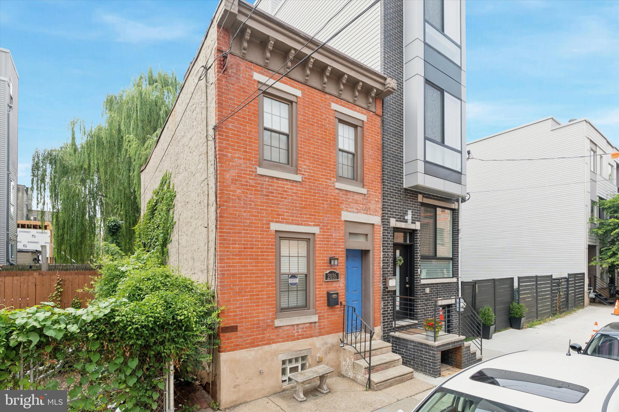 Welcome to 2036 E Boston Street—a bright, move-in ready townhome nestled in one of Philly’s fastest-growing neighborhoods. Step inside to find a cozy yet functional layout that flows seamlessly from the living area into the kitchen, making entertaining easy and inviting. The open-concept main level features warm hardwood floors, recessed lighting, and a thoughtfully updated kitchen complete with granite countertops, stainless steel appliances, and a spacious peninsula that doubles as a breakfast bar. Upstairs, you’ll find two comfortably sized bedrooms with closet space, plus a beautifully updated hall bathroom that blends vintage charm with modern finishes—featuring a Victorian-style sink, tiled shower, and sleek fixtures. The full unfinished basement offers plenty of storage space plus laundry. Out back, enjoy a private concrete patio—perfect for your outdoor furniture, fire pit, or raised garden beds. Located steps from the best of both East Kensington and Fishtown—think LMNO, Philadelphia Brewing Co., and tons of new shops, cafés, and restaurants popping up all around. Plus, with the Market-Frankford El just two blocks away, you’ll have quick and easy access to Center City, University City, and beyond.