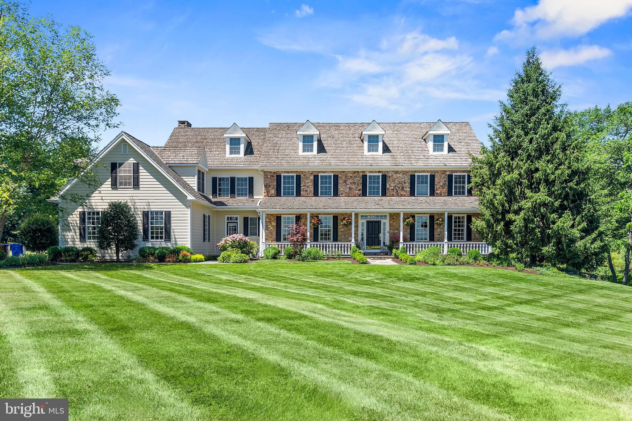 Discover a once-in-a-lifetime opportunity to own a Ferman Lex home, crafted by one of Bucks County's most esteemed builders. This luxurious 5-bedroom, 6-bathroom center hall Colonial is nestled on 2.7 acres of picturesque farmland in prestigious Upper Makefield, offering over 8,900 square feet of refined living space. Exquisite craftsmanship is evident throughout, from intricate dentil crown moldings to solid hardwood floors. Soaring 9'-foot ceilings and large windows bathe each room in natural light, while soft, warm colors create an inviting ambiance. The heart of the home is its gourmet kitchen, featuring a gleaming granite countertop, energy-efficient appliances, and a 6-burner gas range with a center grill and dual ovens. An adjoining patio provides grand views of the expansive property, perfect for morning coffee or evening relaxation. The thoughtful layout caters to both everyday living and elegant entertaining. A formal dining room with butler's pantry sets the stage for sophisticated gatherings, while the open kitchen, family room, and breakfast nook combination creates a warm space for casual moments. A large first-floor office provides a quiet retreat, and two brick gas fireplaces add to the home's overall warmth. Five separate zones of environmental control ensure comfort for everyone throughout the year. Upstairs, the primary bedroom suite boasts an elegant dressing room with built-in dressers and ample wardrobe space including built-in shelving and glass door closets. A second-floor laundry adds convenience, while four additional bedrooms and two full bathrooms complete the upper level. The finished basement spans a massive 3,173 sq. ft., featuring a Bar, Exercise Room, Theater, Storage and Hobby area. An additional 1,657 sq. ft. of finished attic space offers endless customization possibilities. Extensive hardscaping and beautifully designed outdoor spaces enhance the property's allure. The three-car garage, equipped with 220-volt service for electric vehicles, adds a modern touch, while durable Hardie Board siding ensures longevity and low maintenance. Situated within the award-winning Council Rock School District, this home promises an exceptional educational experience. Set against a backdrop of serene streams and abundant wildlife, this Ferman Lex masterpiece seamlessly combines luxury, functionality, and natural beauty, making it the perfect haven for those seeking a prestigious lifestyle in Bucks County. Conveniently located minutes from the charming towns of Newtown, New Hope, and Washington Crossing, this home provides easy access to I-295, Princeton, New York City, and Philadelphia