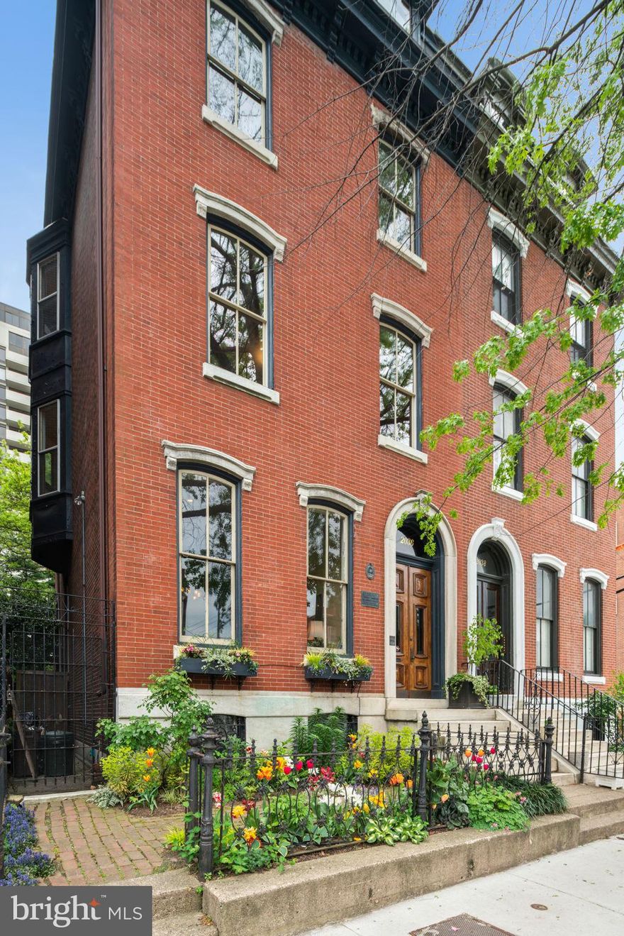 Rarely offered Spring Garden single-family 6 bedroom, 6.5 bath townhouse with 60ft mature landscaped garden and rented parking spot on the next block. Enter double doors to marble foyer with custom Mercer tile inset, leading to entry hall with a large historic mirror. Elegant living room with high ceilings, marble mantel, crown moldings, and oak hardwood floors (with wedding-band inlay). Hall with powder room and door to side garden leads to the dining room with marble mantel and two china closets. Spacious custom kitchen and breakfast area with shaker cabinets, spacious pantry, granite and wood counters, and room for a large table. Sunroom off the kitchen with views of amazing 60 ft. professionally-landscaped South facing garden with brick and stone patios, shaded by mature trees, perfect for entertaining. The second floor South can be accessed from the back stair to a 3 room family area which now includes a Billiard Room, a sitting room, a utility/laundry room, a full bath and a sunny home office/sewing room that feels like you're in a treehouse. Second floor front is a newly built master suite with high ceilings, wood floors, master bedroom with noise reducing windows, a wall of custom millwork bookshelves and dressing room with custom cabinetry. Beautiful new bathroom with oversized stall shower and custom vanity. Third floor rear bedroom suite with decorative mantel, walk-in-closet and full bath with large tiled shower, linen closet and door to deck that overlooks the garden. Middle bedroom with bay window and en-suite bath with wainscoting and tiled tub-shower enclosure. Front library with custom bookshelves and cabinets. Fourth level could be a nanny or in-law suite with a full bath and galley kitchen. Stair to roof deck with great views of the Art Museum, perfect for watching the fireworks. Finished basement with full bath has space for storage, playroom, office, gym, workshop etc. Radiator heat throughout. Sellers rent a parking space for $175/month next to the Medical Society on the 2100 block of Spring Garden. Fantastic location, less than a block from Whole Foods and close to restaurants, The Barnes, The Rodin Museum, The Free Library, Museum of Art, The Franklin institute, Academy of Natural Sciences, Fairmount Park, East and West river drives, public transportation and all Center City has to offer.