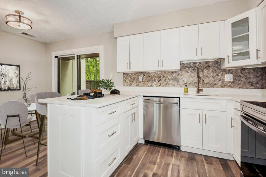 You don't want to miss this very rare three level townhome in Reston’s Sanibel cluster! Conveniently located near the metro rail, the Reston Town Center and Reston National Golf Course. New FULL bathroom recently added to the top level and all bathrooms throughout gorgeously updated! This home has been meticulously cared for and renovated to be as functional as possible. Sellers moved the laundry to the second floor for convenience but there are laundry hookups on the first floor as well and washer and dryer can easily be moved back to the main level.  Enter the home to the open main level floor plan, recessed lighting and laminate flooring. Kitchen features quartz countertops and awesome backsplash. White shaker cabinets and newer stainless steel appliances! Take the staircase in the center of the home to the second and third level bedrooms.  Custom paint throughout. VA loan assumable. Come take a look at this amazing opportunity!