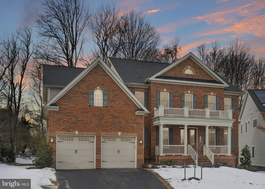 This spacious, 6-bedroom, 6.5-bath home is everything that you have been looking for! Situated on a prime wooded lot on a quiet cul-de-sac, this gorgeous brick home is located in the highly sought-after Clarksburg Village community--close to great amenities!  With over 7,000 finished square feet--there are unique spaces and upgrades throughout--including beautiful crown molding, wainscoting, recently refinished hardwood floors and striking light fixtures. The convenient main-level bedroom with an ensuite bath is just one of this home’s unique features. This gourmet kitchen is a cook’s dream--featuring TWO spacious islands, TWO dishwashers, a wine refrigerator, TWO sinks, granite countertops, a gas cooktop (with built-in hood), and beautiful stainless steel appliances! The impressive two-story family room features floor-to-ceiling windows, a coffered ceiling, elegant built-ins and a gas fireplace. Additionally, the first floor features formal living and dining rooms, a butler’s pantry, a half bath and a spacious mudroom with organizational built-ins and an extra closet! The fully finished lower level is perfect for entertaining! Accommodate plenty of guest at the large wet-bar--complete with a dishwasher and wine fridge--or host movie nights in the large theater room with pre-wiring for surround sound. The spacious lower level also includes an additional bedroom with a walkup, a full bathroom, and two bonus rooms! The upper level features 4 spacious bedrooms, each with a private ensuite bathroom, and a convenient second-floor laundry room with plenty of cabinetry, counter space for a laundry station and a utility sink! An amazing retreat awaits you in the spacious Owner’s Suite, which features a spacious sitting room, customized walk-in closet and a luxurious spa bath with soaking tub and an extra large tiled shower. Enjoy your morning coffee on the balcony overlooking the serene wooded backyard!  This home has it all and will not disappoint! Come and see it--before it’s gone!