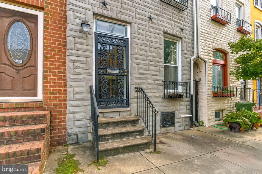 WELCOME TO LUCKY #7 S ANN STREET.  ONLY A FEW BLOCKS FROM JOHNS HOPKINS, AND AN EASY WALK TO DOWNTOWN FELLS POINT  FROM THE FRONT DOOR.  THE FIRST FLOOR FEATURES A LARGE EXPOSED BRICK WALL IN THE LIVING ROOM AS WELL AS A GOOD SIZED KITCHEN WITH AMPLE CABINET SPACE, A VAULTED CEILING, AND 2 SKYLIGHTS.  THE FRONT FACING MASTER BEDROOM IS ON THE SECOND FLOOR ALONG WITH THE BATHROOM. TWO ADDITIONAL BEDROOMS CAN BE FOUND ON THE THIRD FLOOR.  THE EXTERIOR OF THE HOUSE FEATURES A LARGE REAR YARD WITH A BRICK PATIO, AND 6'HIGH PRIVACY FENCE. TAKE NOTE THAT THE ALLEY AT THE REAR OF THE PROPERTY COULD POSSIBLY ALLOW FOR THE CONSTRUCTION OF A PARKING PAD IN THE REAR OF THE PROPERTY.  DON'T LEAVE WITHOUT CLIMBING THE STAIRS TO THE 15' X 20' ROOF TOP DECK. THE VIEW OF THE CITY IS SPECTACULAR!!! HOUSE IS BEING SOLD "AS- IS", BUT THE OWNER IS OFFERING A ONE YEAR  AHS SHIELD PLUS WARRANTY WITH AN ACCEPTED OFFER.