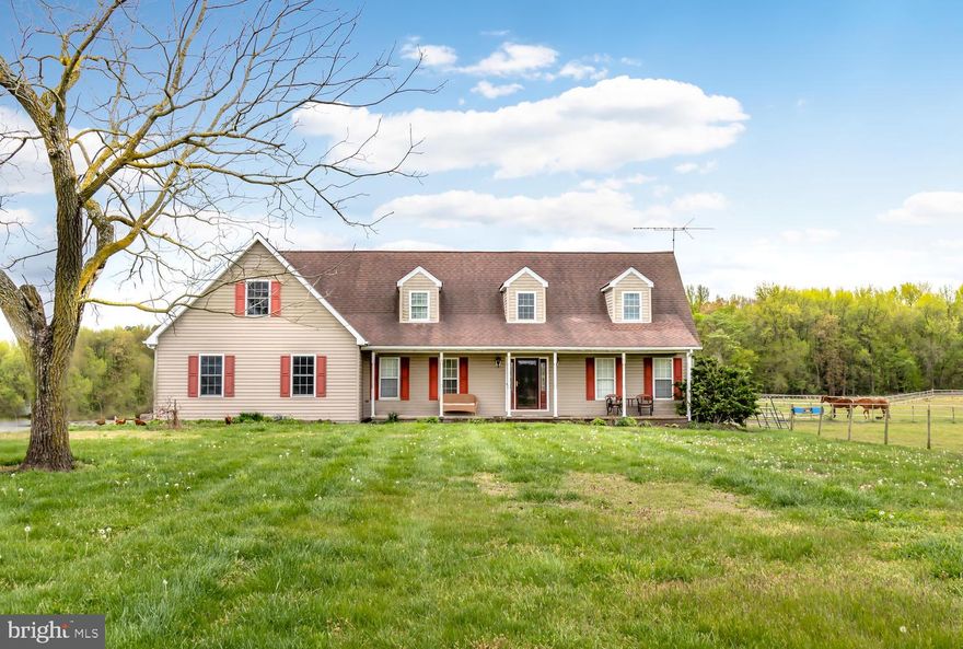 Nice Cape Cod Farmette situated on 11+acres with so much to offer! Two main level bedrooms and full bath, two large bedrooms and full bath upstairs with huge walk-through closet.  Home offers opportunity for in-law suite, with a rough-in for additional bathroom in the mud/laundry room that also connects to huge bonus room above the two car garage. Large walk in pantry, stainless steel appliances, gas stove for cooking, a hot tub to enjoy on the back deck. 40x60 outbuilding with separate electric and water and includes large walk-in fridge.  The electric fencing in place is ran by owned solar panels and there's an additional water source for livestock. Many new features to include furnace, central air on first floor, newer hardwood floors, roof replaced in 2007 and well replaced in 2005. Very low utilities, electric average $200/month! Home was built with 6 inch walls rather than the common 4 inch, as well as having a propane stove in the living room.