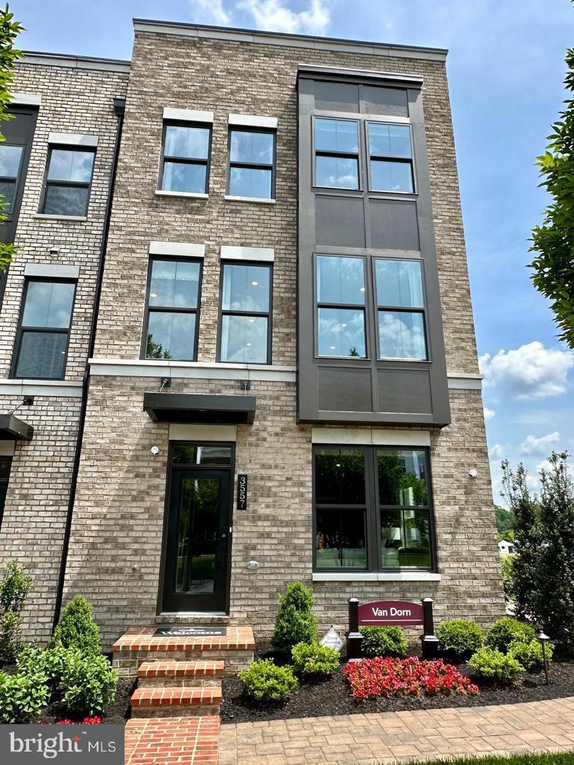 Model home for rent in the highly sought-after Villages of Urbana! This luxurious 3-level townhouse offers over 2,200 sq. ft. with 3 bedrooms, 3 full baths, and 2 half baths. The open main level features wide plank hardwood floors, a gourmet kitchen with stainless steel appliances, quartz countertops, a center island, dining area, and a spacious living room that opens to the rear yard. The elegant primary suite includes a tray ceiling, walk-in closet, and a spa-like bath with double showers and a dual vanity. Enjoy bedroom-level laundry, a 2-car garage with an EV charger, and space for two more cars in the driveway. TVs on all levels are included, along with washer, dryer, blinds, curtains, and fireplace. Community amenities include a pool, tennis courts, playgrounds, and top-rated Urbana schools—all within walking distance to shops, recreation, and the library. Model home pictures attached!