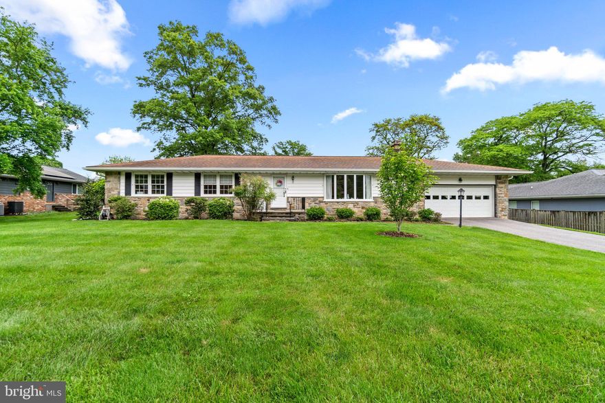 A cool slate foyer and freshly painted interiors invite you inside this updated rancher offering over 2,536 sqft, fresh lighting, refined crown molding, lovely hardwoods, a spacious living room with a bay window and a brick-stone surround fireplace, followed by a dining room bright with natural light from a second bay window.
Awaken your culinary talents in this cook’s kitchen presenting exotic granite counters, 42" raised panel cabinetry, stainless steel appliances, and an open breakfast room with a glass slider stepping to a stone patio.
Nicely finished lower level features new flooring, a rec room and games area, a bonus room, plus a walk-up to the patio and verdant backyard.
Set back on a gorgeous landscaped .47 acre homesite, with exterior amenities including a 2-car garage, a stone patio, and a backyard with plantings, flowers, and trees.