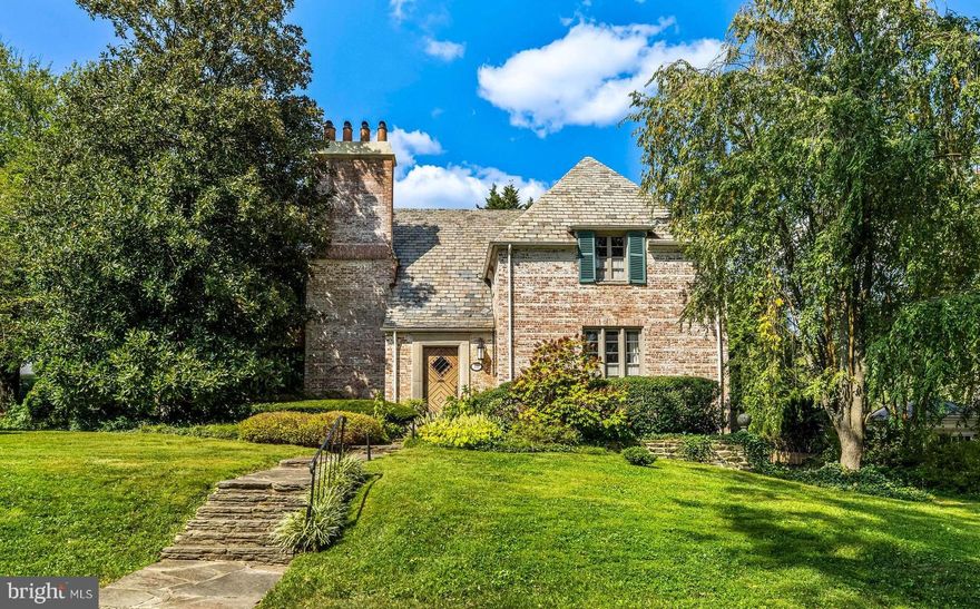 Designed by Winthrop Wollcott in 1928 and built during a time when special details and craftmanship really mattered, this French Norman Style  5 Bedroom, 5/1 Bath all brick home is filled with abundant design and elegance. Mahogany trim, casings and doors throughout. Every detail reflects thoughtfulness and creativity.  A central Octagonal Foyer opens to Living Room with fireplace, two sets of French doors to Patio and Gothic-arch door to a delightful loggia, perfect for entertaining and alfresco dining. Cozy Library with built-in bookcases and Powder Room. Formal Dining Room also has French doors to Patio.  The Cook's Kitchen with stainless steel appliances, workstations and counters. Subzero Refrigerator and Viking 6 Burner gas range. Old-world Butler's Pantry with vintage Dutch cabinetry, granite counters and access to intimate Breakfast Room. Sumptuous Primary Suite with updated Bath, Dressing Room. Another bedroom/dressing room adjoins.  2 additional Bedrooms and 2 Baths complete the 2nd Level. A Bedroom and Bath are found on the 3rd Level. The Lower Level includes Laundry, Workroom, full Bath and access to 2-car Garage. As if in the French countryside, the brick-walled back yard encloses beautiful gardens. Many gracious updates and details, including bespoke lighting in every room! A prime Homeland location, in the first block of  Historic Homeland's Saint Dunstans Road, convenient to schools, churches, shops, downtown and beltway.