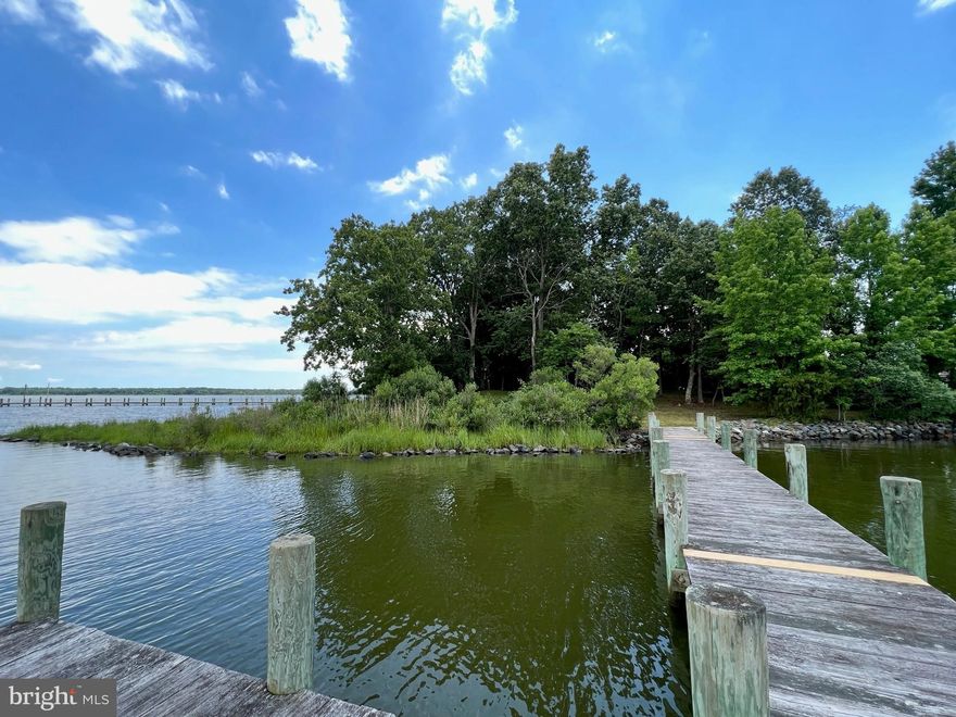Recreation lot.  Secluded waterfront non-buildable lot with waterfrontage on two sides totaling 400ft on Canoe Neck Creek.   Camp, fish, crab or tie your boat up at the pier!  Peaceful, relaxing setting with a panoramic view.  Quick boat ride to Saint Clements Bay and the Potomac River.