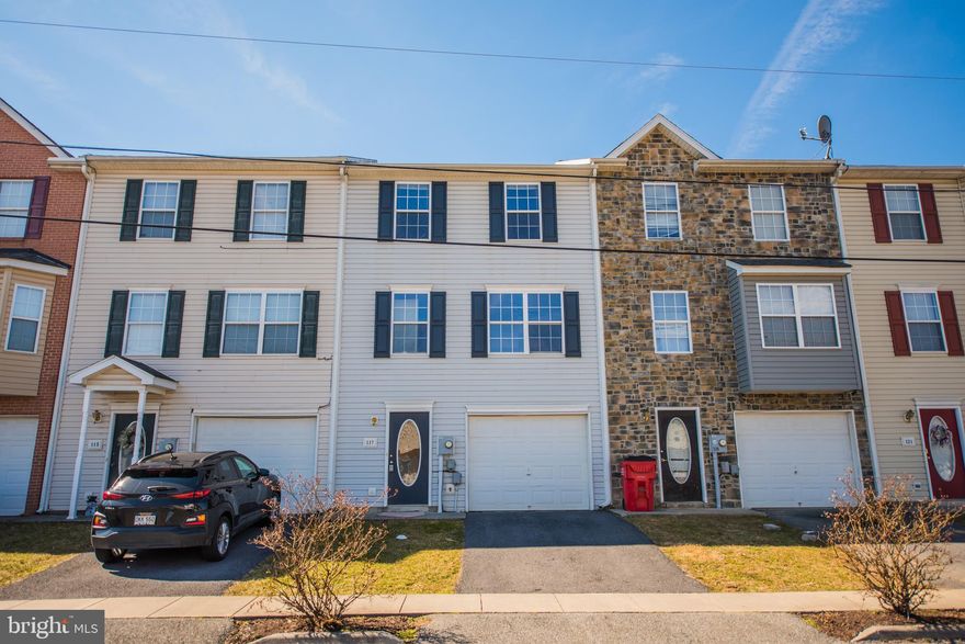 Spacious townhome  with open main floor plan and 3 levels to spread out. New bamboo floors on upper 2 floors and new carpet on stairs. Rec/Family room on first level with separate laundry area. This home has also been freshly painted. You don't want to miss this affordable home. Convenient to everything!