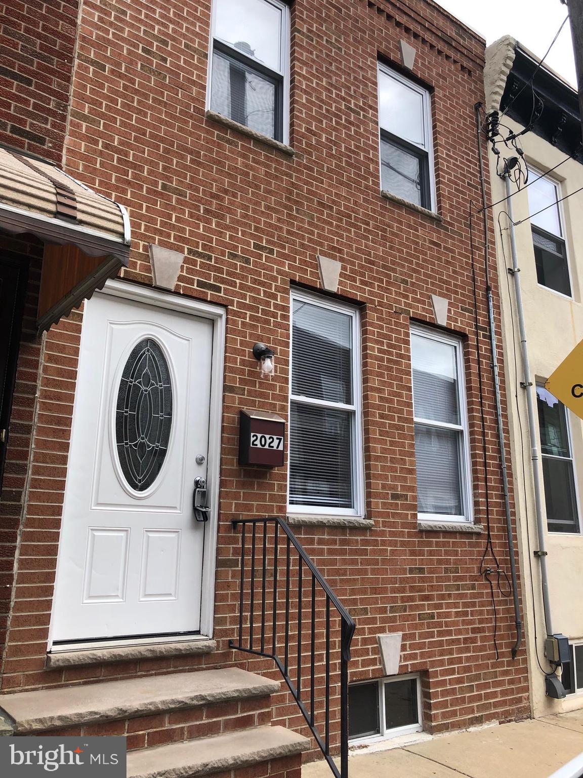 2027 S Darien street is among this walkable stretch of the south Philly which offers ample attractions! Walk up to this brick facade home and you ll find beautiful hardwood floors which can be found throughout the home. The spacious living/dining room is thoughtfully laid out for entertaining or relaxing. The 2 front windows allow for ample natural light to fill the room. Walk pass the conveniently located bath and you ll find your kitchen. This L shaped kitchen has matching appliances, and plenty of cabinet space. Leading out the back door you can find your outdoor oasis just waiting for you to put your personal touch! Head up to the 2nd floor and you ll find your fully tiled bath & 2 sizable bedrooms with closet space, & ceiling fans with additional lighting. The basement is equipped with your washer & dryer and is the perfect space for extra storage! With a walk score of 93, this home is near it all! Take advantage of BOK bar voted one of Philly s favorite rooftop bars just 2 mins away, grocery stores, cafes, bars & restaurants, & 3 block walk to the bus stop!