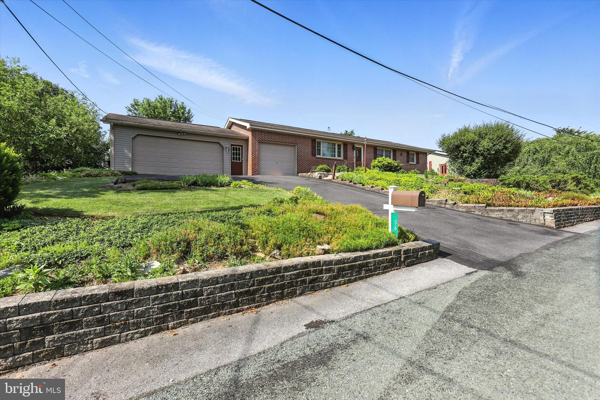 Welcome to 36 Hillside Drive – a sprawling all-brick rancher featuring 2300 sq ft of living space offering comfort, charm, and convenience in a prime location close to shopping and schools. This one-owner home has been lovingly maintained and cared for and features warm hardwood floors throughout with 3 bedrooms, 1.5 bathrooms, kitchen, and a cozy dining area perfect for everyday living. Enjoy the sunroom overlooking the large fenced in backyard, ideal for relaxing with a book after a long day. A spacious mudroom off the attached 2-car garage adds practical convenience, along with a bonus storage room on the main level. The full finished basement offers even more living space with a large family room, a workshop, and a wet bar for game night with friends or holiday gatherings! Don’t miss this one-level gem with room to spread out both inside and out! OPEN HOUSE SUNDAY, JULY 20th 1-3PM!!