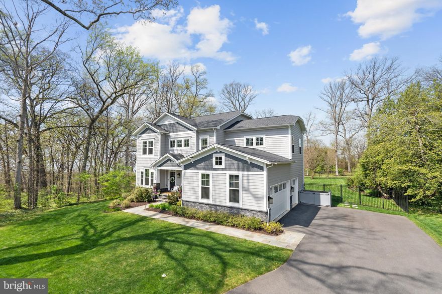 Welcome to this flawless 5300 sq ft home- over 4800 finished sq ft with nearly 500 sq ft of storage area- located in a serene and tranquil country setting.  Just four years old and sited on a sprawling 3/4 acre lot on a dead end street in the highly coveted Wellington neighborhood.  This flawless home boasts the perfect balance of elegance, comfort and style.  With 5 bedrooms and 5.5 luxurious baths plus almost 5300 sq ft of living space, make it ideal for hosting grand events or intimate family gatherings. Each bedroom has its own private bath. The primary suite has a spa like steam shower and custom designed closet.  The exquisitely designed mudroom, with built-in cabinetry, ensures that every inch of the home is impeccably organized.   All flooring on main and upper level is hardwood with luxury vinyl in the lower level.  
Enjoy the ultimate culinary experience in the chef's kitchen, equipped with top-of-the-line Subzero 90 bottle wine refrigerator, Wolf range and expansive center island, making it the heart of the home.  Step outside and be transported to paradise in the yard of your dreams- add a pool, sports court or putting green and still have plenty of space for gardening and hobbies. 
 Entertain in style on the spacious trex deck, complete with gas and TV hookups and enjoy al fresco dining on the stone patio.  This home has been thoughtfully designed with gas generator, whole house vacuum, main level office and large laundry room on the bedroom level.   The walk-out lower level offers a gym/ bedroom, a massive recreation room with wet bar and beverage refrigerator plus ample storage, making it a perfect place to unwind and relax.
This property is a rare gem, offering the best of both worlds, close in location and country setting.  Its  expertly located just steps away from the bike trail, 20 minutes to Downtown DC, and only 5 minutes to Old Town, yet still offering the serenity and tranquility of life in the country.  Life simply doesn't get any better than this.
