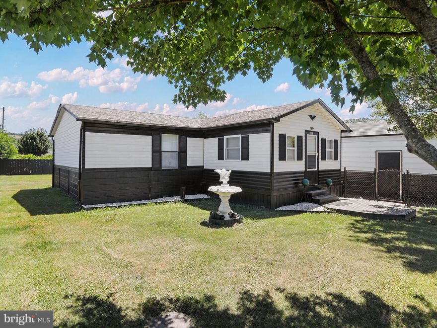 Meticulously maintained and wonderfully updated manufactured home with a fully fenced yard, front and rear finished porches, and a massive detached garage!  This one is as good as it gets!