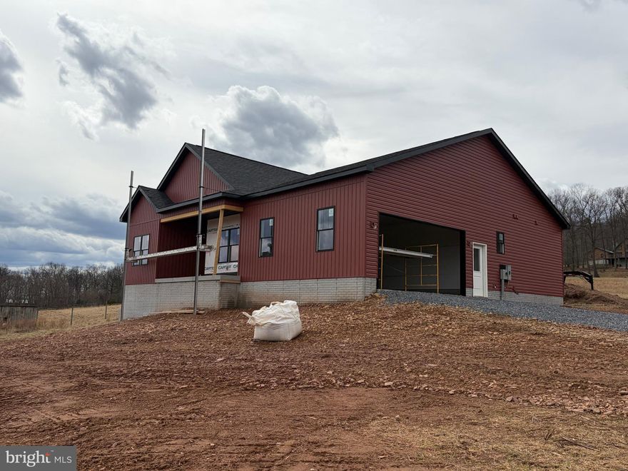 Mid-May Delivery! Nestled on five serene acres within prideful community, this home is a harmonious blend of comfort and natural beauty.  Costruction has been started. MOST PHOTOS ARE OF SIMILAR CONSTRUCTION. The mature trees lining the northern border add privacy, while a small wet weather pond adds natural charm. Located just 21 miles from Winchester, VA, 13 miles to Inwood and only 18 miles to Martinsburg, this property offers the rural feel without sacrificing accessibility. Enjoy community amenities including a catch-and-release fishing pond, gazebo, picnic area with BBQ grill, and private access to Sleepy Creek Wildlife Management via a scenic path from Cressida Drive.  This new build is thoughtfully designed, the residence offers three spacious bedrooms and two and a half bathrooms, perfect for modern living. A full basement offers endless possibilities. The open-concept floor plan flows effortlessly, featuring a welcoming living space that invites relaxation and gatherings. The heart of the home is a gourmet kitchen, where you’ll prepare meals while enjoying tranquil views of the surrounding woods. Step outside onto the covered, maintenance free back porch, where mornings can begin with a coffee in hand and evenings conclude with a beverage of your choice under a starlit sky. Designed for both convenience and privacy, this home includes a two-car garage with ample storage space. Whether you’re hosting family or simply retreating from the world, this wooded sanctuary offers peace, luxury, and a daily connection to nature. Schedule your tour today.