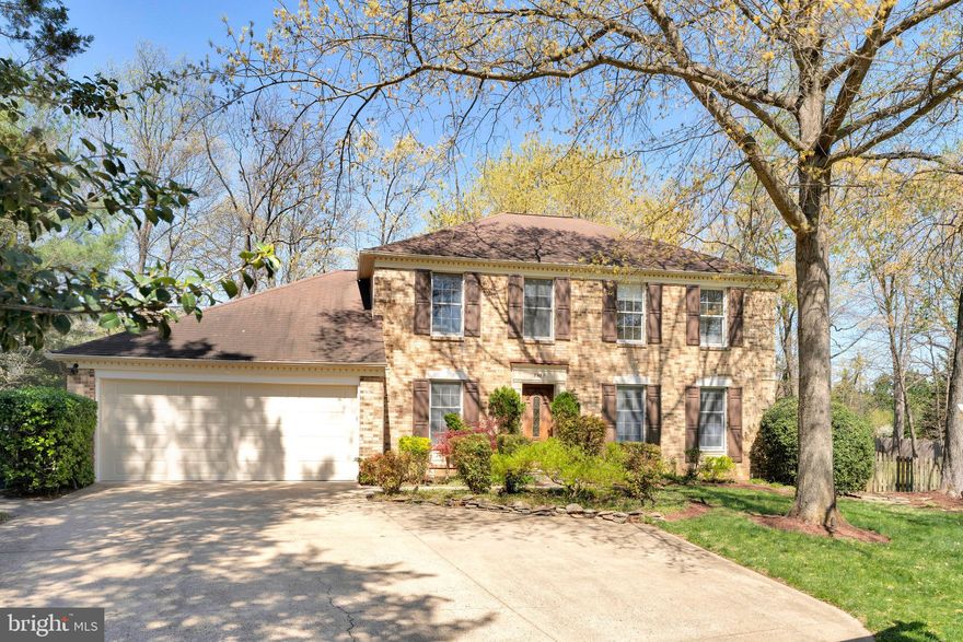 Welcome to this lovely home! This charming brick Colonial, offers a perfect blend of classic elegance and modern comfort. Nestled on a generous 0.47-acre lot in a peaceful cul-de-sac, this property boasts a beautifully landscaped rear yard, ideal for outdoor gatherings or quiet relaxation. Step inside to discover a warm and inviting interior featuring an open floor plan that seamlessly connects the kitchen and living areas, with access to the screened in porch and large patio. The heart of the home is the kitchen, equipped with stainless steel appliances, perfect for culinary enthusiasts. Enjoy casual meals in the cozy breakfast area, or entertain guests in the spacious living room adorned with crown moldings and gleaming hardwood floors.  Gather around the family room gas fireplace  on chilly evenings, creating a warm ambiance throughout the home.  With four well-appointed bedrooms and three and a half bathrooms, including an updated primary bath, this home provides ample space for everyone. The fully finished basement offers additional living space, perfect for a home theater or play area. Additional highlights include a convenient attached two car  garage with newer garage doors, a sprinkler system for easy lawn maintenance, and tasteful window treatments that enhance the home's charm. This property is not just a house; it's a place to create lasting memories. Tucked away but close to everything, this home is minutes to Tysons Corner, the Silver Line Metro, an abundance of shops and restaurants, and main commuting routes. Don’t miss the opportunity to make this inviting residence your own!
