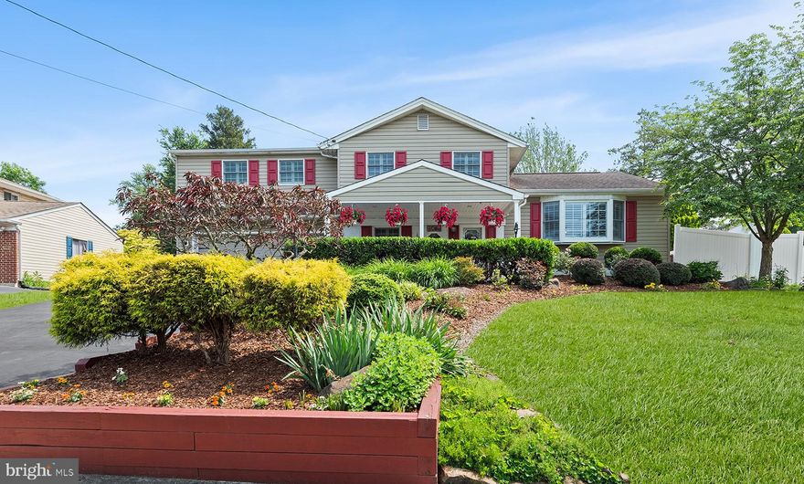 Welcome to 1081 Little Lane, an exquisite Hartsville Park residence with stunning gardens and elegant modern upgrades. This impeccably maintained split-level home, nestled in the sought-after Hartsville Park community, is a true haven for garden enthusiasts with extensively landscaped grounds boasting lush perennial beds, raised vegetable gardens, and an inviting in-ground pool—creating a private outdoor sanctuary. Inside the home, every detail has been thoughtfully considered. All rooms have been freshly painted, newly carpeted, and tastefully modernized, blending classic charm with contemporary style. The main level features a refined living room with elegant pocket doors that open to a stunning eat-in kitchen, complete with sleek finishes and views of the vibrant gardens. Just a few steps down, a warm and inviting family room centers around a cozy wood stove—perfect for relaxed evenings. A showstopping sunroom spans the rear of the home, with walls of windows offering panoramic views of the fully fenced backyard oasis. A main-level bedroom with an adjacent half bath provides flexibility for guests or home office needs. Upstairs, the massive owner’s suite is a true retreat, featuring a spa-inspired ensuite bath with exceptional scale and finishes. Two additional bedrooms and a stylish second full bath complete the upper level. The finished basement adds versatile living space, anchored by a gas fireplace for supplemental comfort during colder months. Additional highlights include an attached two-car garage, a brand-new HVAC system, and a new water heater. Perfectly positioned near top-rated schools, local dining and shopping destinations, and convenient access to train and bus stations, this exceptional property offers the ideal blend of luxury, comfort, and location.