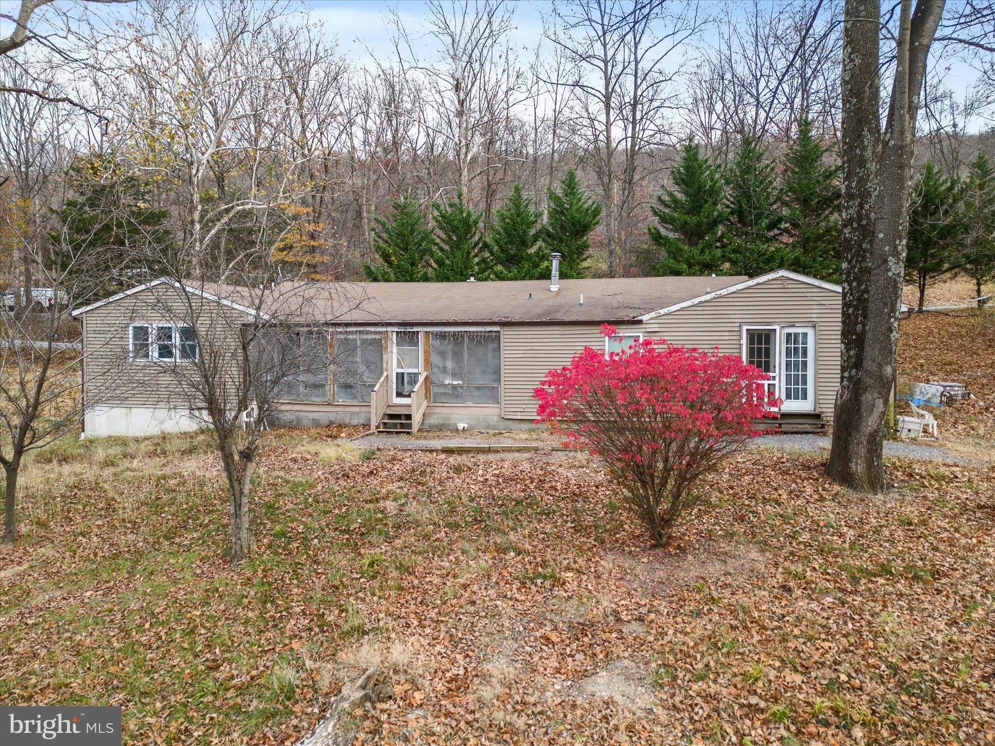 MAJOR PRICE ADJUSTMENT!!! Investor special! Welcome to this diamond in the rough in the sought after community of Blue Ridge Acres. This spacious rambler has plenty of room for you to stretch out and make it your own. With 4 bedrooms and 2 ½ baths there is room for family and friends and also has a massive living room with a fireplace with a wood burning stove. Situated on 8 lots totaling 2.04 acres, you have room to breathe and is located within walking distance to the community pool. This home needs work and will go only cash, conventional or rehab financing, but the bones are good and the footprint extremely livable. Schedule your showing today!