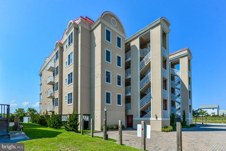 Wow! What a gorgeous direct bay front  luxurious 3 bedroom and 3 bath condo. This beach house has it all: breath taking open water views. Viking gas grill on the 10'' wide private covered balcony. Hardwood floors throughout, Kraft maid cabinetry with granite countertops, hardwood floors, marble baths, 9'' ceilings, gas fireplace, designer furnished, extra storage, bay front pool, and just a short walk to the Beach. Put this on your must see list!