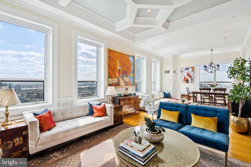 Located on the highest floor of The Aria, Unit 33A is a sprawling two bedroom plus study, two and a half bathroom penthouse with see-forever 360 degree city views from every room, even the bathrooms. From the rich wood floors and high-end selections to the soaring coffered ceilings with intricate details, this residence is one-of-a-kind. Enter into the condominium off of a secure fobbed elevator. There is long gallery hall with domed ceiling and marble tile floor that leads to a light-filled great room with walls of oversized windows showcasing see-forever sunrise city views over the river, an electric fireplace with glass built-ins, and spacious living and dining areas, perfect for open-concept living. Off of the great room is the study, which has tons of natural light, gorgeous woodwork and trim, custom built-ins, and beautiful pocket doors for privacy. The designer kitchen enjoys sleek white cabinetry, dark granite countertops, gray tile backsplash, large pantry, breakfast bar, and stainless steel appliances including a Sub-Zero refrigerator, Bosch dishwasher, and Viking oven with gas range and Zephyr hood. One of the most desirable features of this home is the lavish primary suite that enjoys a sitting area, incredible closet space, including multiple walk-in closets and wall closets, all with custom built-ins, and an ensuite marble-appointed bath with double vanity, glass enclosed walk-in shower, soaking tub, and sunset views. The guest bedroom suite is privately situated on the opposite side of the residence and enjoys a full ensuite bathroom with upgraded vanity and glass enclosed stall shower. Additional home highlights include a powder room with floor-to-ceiling tilework, a laundry closet with storage space and Bosch stackable washer/dryer, a trash chute within a closet off of the entrance hall, exquisite moldings and trim, unimaginable closet space, and a 300 sf storage unit in the basement- the largest unit in the building.

Residents enjoy a state-of-the-art fitness center, a spacious entertaining suite with thoughtfully appointed kitchen, a meeting & conference center, lounge, 24-hr concierge, parking, storage in basement and a luxurious pet spa with special services.

Located in the Rittenhouse Square neighborhood, The Aria residents will appreciate living in the heart of the city’s cultural epicenter, with world class shopping & gourmet dining. Penthouse units are above the 30th floor and feature 360 Degree views.