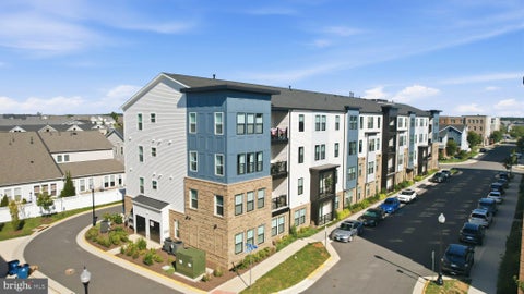 Photo of 23679 Bolton Crescent Terrace #305, ASHBURN, VA 20148 (MLS # VALO2132716)