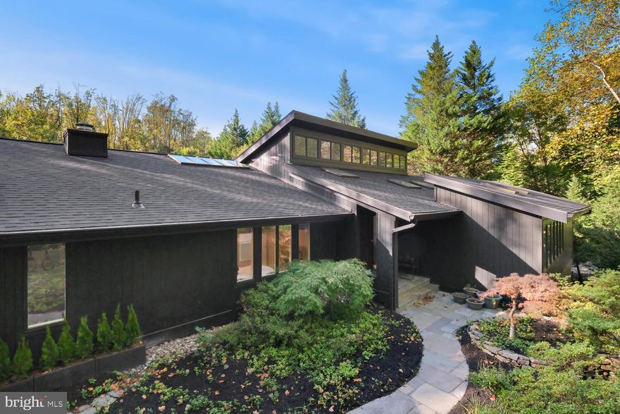 Welcome to 11116 Arroyo Dr, a breathtaking mid-century modern masterpiece offering the convenience of single-level living on a meticulously landscaped 1.21-acre lot.

Stroll along the elegant flagstone walkways, surrounded by lush Japanese Maple trees, and discover your private outdoor oasis complete with a tiered deck, sparkling pool, a brand-new sunk-in stone fire pit, and a recently updated tennis court (2023) with an improved drainage system.

Step inside to find natural light pouring through expansive windows, highlighting vaulted ceilings and stunning hardwood floors, creating a warm yet sophisticated ambiance. The open-concept main level flows effortlessly from the skylit entryway into the formal living room, where a striking floor-to-ceiling brick fireplace becomes the focal point, then seamlessly continues into the formal dining room—perfect for entertaining.

The gourmet open-concept kitchen is truly a chef's dream, bathed in natural light streaming through overhead skylights that illuminate every corner. Thoughtfully designed for both function and style, this kitchen is equipped with top-of-the-line stainless steel appliances, including a brand new state-of-the-art induction oven and a Sub-Zero refrigerator. Exquisite leathered onyx granite countertops provide a tactile and luxurious finish. The centerpiece is a striking central island, ideal for casual family meals or entertaining guests.

The spacious primary suite is a serene retreat featuring a tranquil sitting area, a custom walk-in closet, and a luxurious en-suite bath with double vanities, a soaking tub, and a spa-like shower with a sauna for ultimate relaxation. This level also offers a cozy family room with sliding glass doors that lead to the covered portion of the tiered deck, a second bedroom, a convenient laundry room, and access to the oversized two-car garage.

Discover the walk-out lower level that expands your living space with a spacious recreation room, three additional bedrooms, a full bath, dedicated spaces for exercise, gaming, and hobbies, and ample storage.

Recent upgrades include whole house renovations, a brand-new architectural shingle roof (installed September 2024) with a 50-year transferable warranty, and a beautifully landscaped yard featuring a deer-proof fence and sophisticated copper outdoor lighting. A new whole-house water filtration system adds even more convenience to this remarkable home.

Experience this remarkable property's perfect blend of comfort, style, and outdoor living!

Ideally located near Tilden Woods Park, Tilden Woods Pool, and North Farm Pool, this home offers easy access to I-270, I-495, Route 355, and the North Bethesda Metro Station. It’s also a short distance from Pike & Rose, Montgomery Mall, and the Strathmore Music Center, providing a wealth of dining, shopping, and entertainment options.