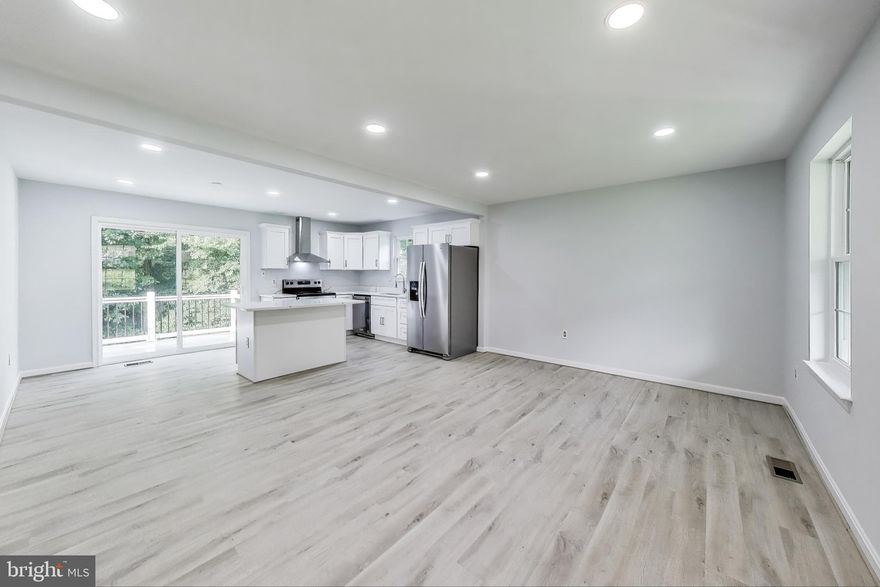 A bright and updated raised rambler,  beautifully maintained and recently remodeled home offering 1,632 sq ft of comfortable living space. The main level offers an open concept living room, a brand new kitchen with stainless steel appliances, great big refrigerator perfect for cooking and entertaining with  an added insland  and eat in kitchen, walk to a new deck with stairs out to backyard. The level also has 2 bedrooms with 1 shared bath. The walk out basement offers 2 bedrooms, 1 full updated bath, family room, spacious utility room and walk out to a private and spacious back yard.