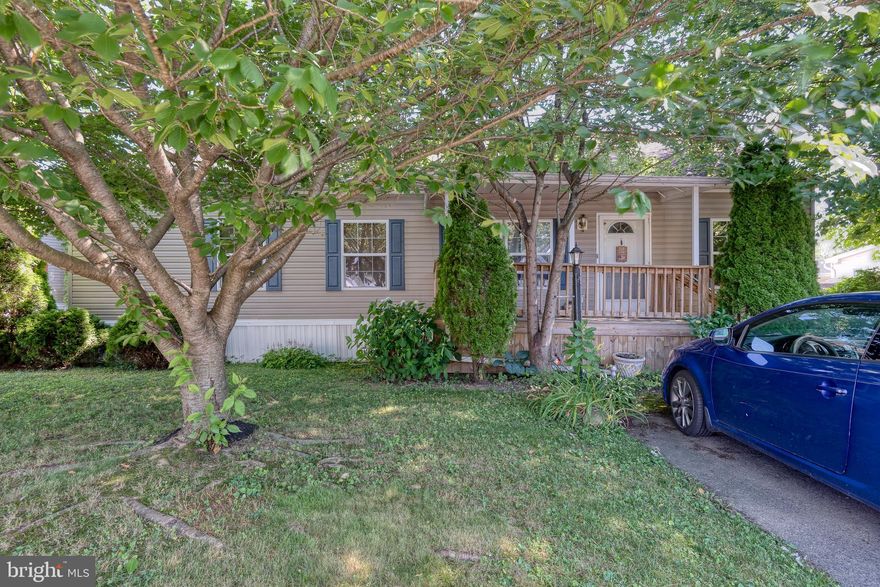 Large manufactured home available in desirable Pheasant Ridge.  The spacious and open layout includes an eat-in kitchen with breakfast bar, ample cabinets and new flooring. Large attic with pull downs steps for storage, it is the only one like it in the community. Enjoy the front covered porch and rear deck. Off-street parking for two cars.  New water heater in 2021 and electric fireplace included. Pheasant Ridge offers many amenities to residents, including a community pool, basketball court, 24 hour fitness center, walking paths and playground.  The lot rent includes curbside trash removal, recycling and Comcast cable television.