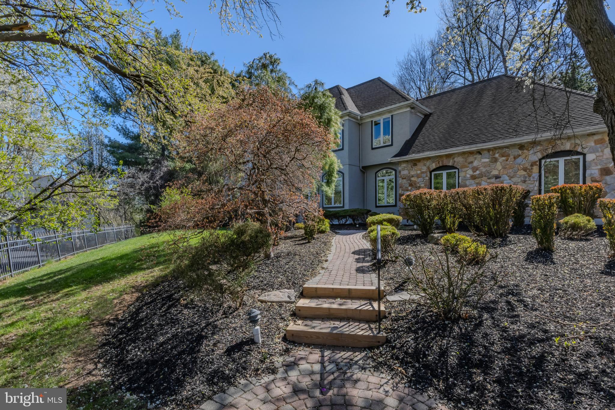 Welcome to 309 Bowers Ln. in the coveted Rose Tree Media School District, offering you a resort like lifestyle just minutes from some of the best shopping & dining in Media Boro. This exceptionally appointed 4,000+ sf home with in- law quarters in the lower level & property is something out of a magazine. Pull up and fall in love with the cul-de-sac setting & the stature of the home itself, perfectly perched on the 1.36 acre lot. Pull into the long private driveway & head on in. The 2 story foyer greets you & so does tons of natural light that comes from each direction. The first floor of the home is exactly what you’re looking for- a large circular flow, all the living space you need to include a grand formal living room with fireplace & arched windows, a stunning formal dining room with ceiling beam, picture frame molding detail & oak floors with a walnut inlay. The beautifully renovated kitchen has a massive center island for seating & storage, top of the line stainless steel appliances to include a 48 inch range, gorgeous stone countertops & upgraded cabinetry & lighting. The sellers thoughtfully renovated the kitchen top to bottom & installed the most gorgeous & custom oversized slider door that lets in so much light, offering access to the large trex deck & property. The butlers pantry space is perfect for entertaining & equipped with a 2nd fridge/freezer, dishwasher, wet bar, top of the line wine fridge, gorgeous glass front cabinets & tons of counter space for setting up your cocktail bar. Don’t miss the built-in Miele coffee station! The 2 story great room off the kitchen with its stonefront floor to ceiling fireplace, skylights & oversized windows is the perfect place to host guests, but more importantly your respite after a long day. The office is right off the great room. The first floor powder room is large with custom tile-work, hidden cabinetry with sink & laundry (1 of 3 laundry set ups in the home)! The slate style tile throughout the kitchen, butlers pantry, entry from the 3 car garage & powder room makes this side of the home feel cohesive & so does the oak hardwood flooring on the other side of the home that was just refinished. The 2nd floor offers 4 large bedrooms, (one currently used as a dressing room), each with great closet space. The primary bedroom has a vaulted tray ceiling, custom millwork, high end carpet, 2 walk-in closets & a renovated bath with soaking tub, high stunning fixtures, gorgeous tilework & seamless shower surround. Enjoy a 2nd laundry set up on the 2nd floor. The walk-out lower level of this home has so much going for it! A secondary kitchen with stainless steel appliances, tons of cabinets, fridge & walk-in pantry, full bathroom, 3rd laundry area, a large and open rec room with wet bar & a room that could make a perfect office or bedroom. This lower level is perfect for an in-law suite, au pair or guests. Your outdoor oasis awaits! The pool, landscaping, swim up bar (with tv and countertop), hot tub, mermaid fountain, built-in speaker system & pool house makes this property unbelievable! The poolhouse has 2 different changing areas & 2 bathrooms so your guests won’t ever have to wait. There is nothing not to love about this home & property. The materials used inside and out are top of the line. It’s truly a one in a million opportunity. It’s so versatile inside & out, the current owners have loved it so much & you too will be so proud to call it your own.