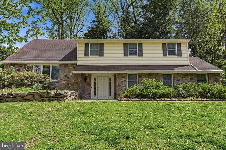 Welcome home to this GORGEOUS 4 bedroom home located in the highly sought-after Sandy Run community of Yardley. Featuring thoughtful upgrades and versatile living space, this home offers the perfect blend of style, comfort and functionality. Step into your welcoming foyer, complete with a built-in organizational system for coats, shoes, and everyday essentials and a convenient powder room. Continue past a mudroom—offering direct garage access and a washer/dryer hookup—to your cozy family room enhanced by exposed beams and anchored by a wood burning fireplace set amongst a stone accent wall. Just beyond, enjoy your bright and spacious sunroom showcasing exposed beams, skylights AND wall-to-wall windows offering panoramic views of your tree-lined backyard! A few steps up, you’ll find your STUNNING gourmet kitchen designed for culinary enthusiasts. A massive island in a striking navy finish is accented by beautiful pendant lighting and features a built-in microwave and prep sink. The kitchen continues to impress with abundant custom cabinetry accented by gold hardware, elegant quartzite countertops, farmhouse sink and a bold designer tile backsplash. Professional-grade stainless steel appliances complete the space, including a Wolf six-burner range with griddle and GE Monogram refrigerator and French door double wall oven—making it a true chef’s dream! A dedicated beverage bar with a GE Monogram double drawer drink refrigerator brings elevated convenience and functionality, while the spacious dining area with sliding glass doors opens seamlessly to your backyard - perfect for indoor/outdoor entertainment! Finishing this level at the front of the home is a spacious formal living room, currently being used as additional dining space.   Continue up another level to four spacious bedrooms, each with ceiling fans and ample natural light. Your luxurious primary suite, recently remodeled to perfection, features a separate flex space ideal for a home office, gym, or sitting area, along with TWO walk-in closets! The luxurious en suite bathroom offers a spa-like retreat complete with stunning patterned tile flooring, dual vanity, standalone soaking tub AND a glass-enclosed rainfall shower with striking floor-to-ceiling tile and built-in bench! The primary suite also includes a dedicated laundry area AND a SECOND full bathroom for added privacy! (The primary bedroom was thoughtfully remodeled to include the expansive primary bathroom, the 2nd bathroom was the original primary bathroom but could easily be re-connected to the large guest bedroom for a full princess suite).   A full hallway bathroom with floor to ceiling tiled tub/shower combo serves the remaining bedrooms.  Back downstairs, the finished basement adds even more living space, including a large family room AND a versatile room perfect for an additional home office or playroom, while an unfinished section provides ample storage.  Step outside to your private backyard, surrounded by mature landscaping that creates a serene and secluded setting. A spacious patio invites you to relax with your morning coffee, unwind at the end of the day, or host gatherings with ease! This home features a two car side entry garage and large driveway for ample parking. Other upgrades include an electric dog fence, NEW roof (2021), NEW HVAC (2021), 2 zone heating, and NEW siding! Walkable to a variety of restaurants and shopping in nearby Yardley Boro AND near Yardley Station offering direct service to Center City, Trenton Mercer Airport AND I 295 for easy commuting! Pennsbury School District too! Don’t miss your opportunity to see this beautiful home today! **Seller is also including a one year home warranty to the future buyer**