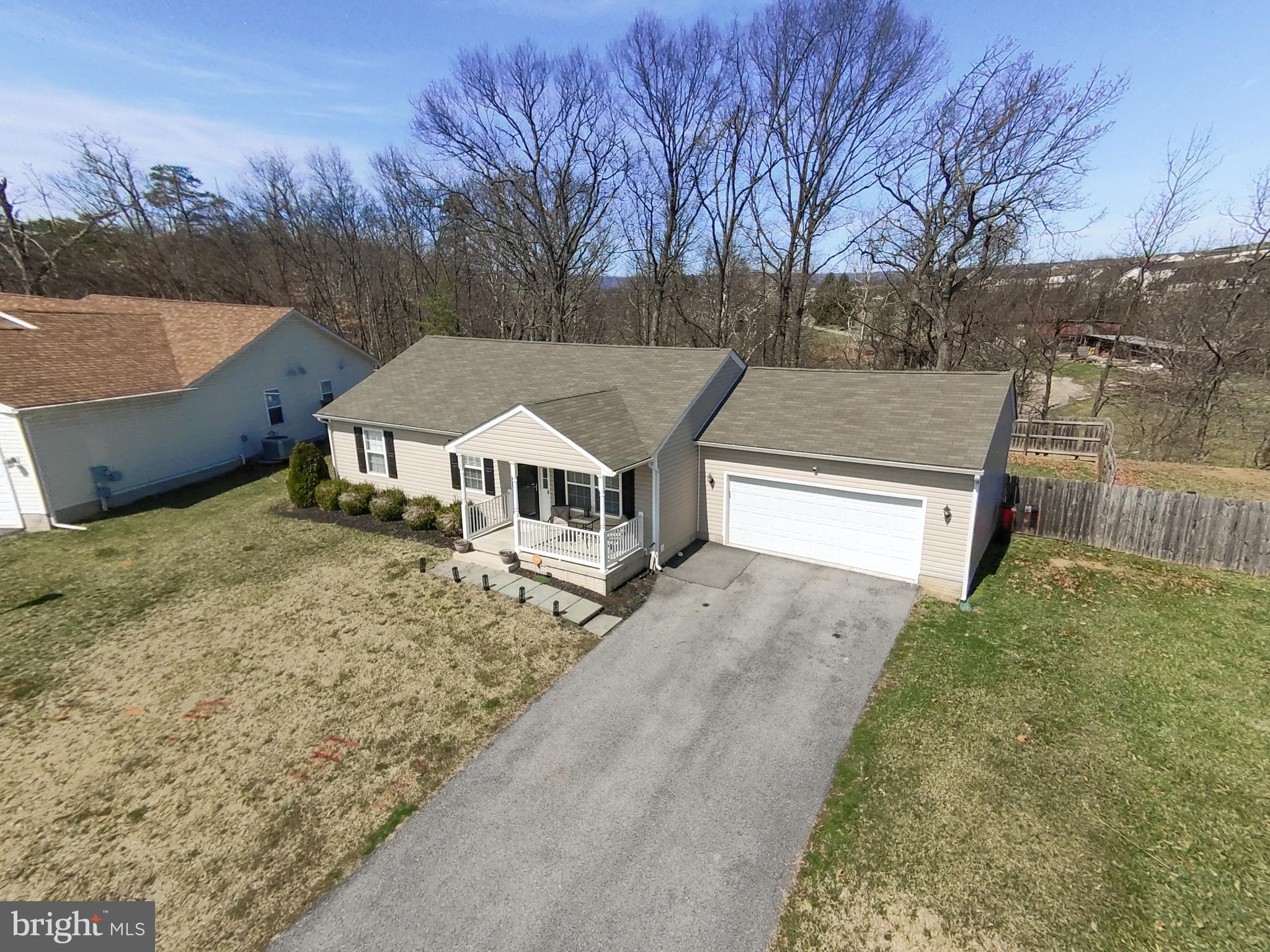 *OFFER DEADLINE IS 4/1 AT 5 PM.*Well maintained 3 bd/2 ba rancher with lower level! Walk in from front porch to inviting family room with vaulted ceilings. LVP flooring throughout the main level. Kitchen and dining room are open and great for entertaining. Walk out from dining area to 40 x 14 stamped concrete patio and private expansive backyard backing to trees. Primary bedroom offers an en suite bath. Two secondary bedrooms share a full hall bath. 200-square foot office in lower level is great for telecommuting and keeping work/life separation. Rest of the walk-up lower level is spacious and ready for your finishing touch! Other features include insulated garage. Newer A/C.