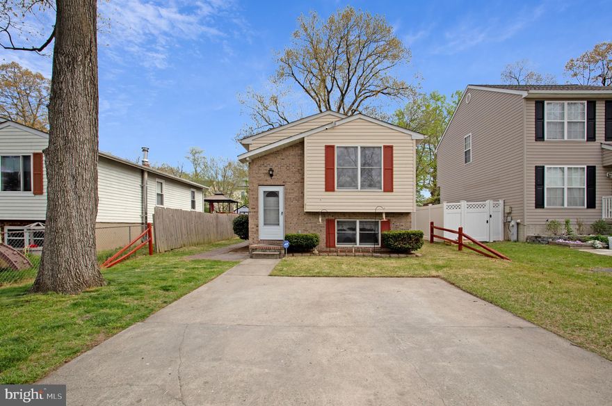 Welcome to this bright, charming home on a quiet dead end street in Glen Burnie Heights. The open floor plan allows for plenty of space to gather friends and family together. The newly renovated kitchen boasts quartz countertops, stainless steel appliances, and plenty of cabinets. The large primary bedroom has plenty of closet space and sliding glass doors to the backyard. 
The lower level has a huge family room, an updated full bath, and another generously sized bedroom. Great for guests or multigenerational living. Walk out to the fully-fenced, private backyard and enjoy the peaceful quiet on the large deck.  There are 2 sheds for extra storage.
New flooring upstairs. Fresh paint. All new interior doors and hardware. New front door, storm door and rear entrance door.  Newer roof. Updated water line. Carrier HVAC with programmable thermostat.
