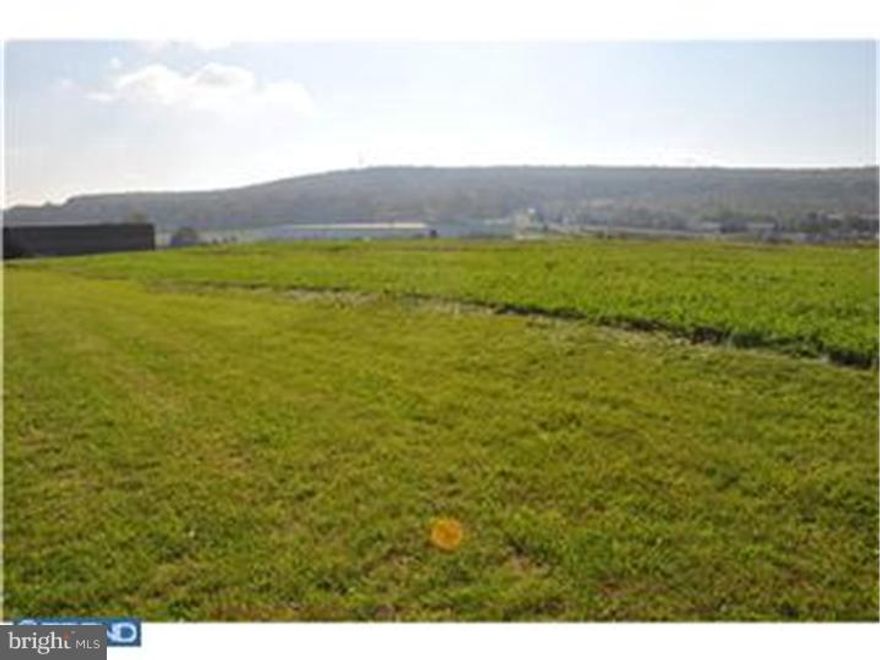 4.95 acres of land in Heritage Corporate Center and located directly adjacent to Walmart and the Morgantown Crossings Shopping Center. Zoned Industrial Office Park (same as Walmart and shopping center). Highly visible from PA turnpike. Building use subject to approval of land owner.