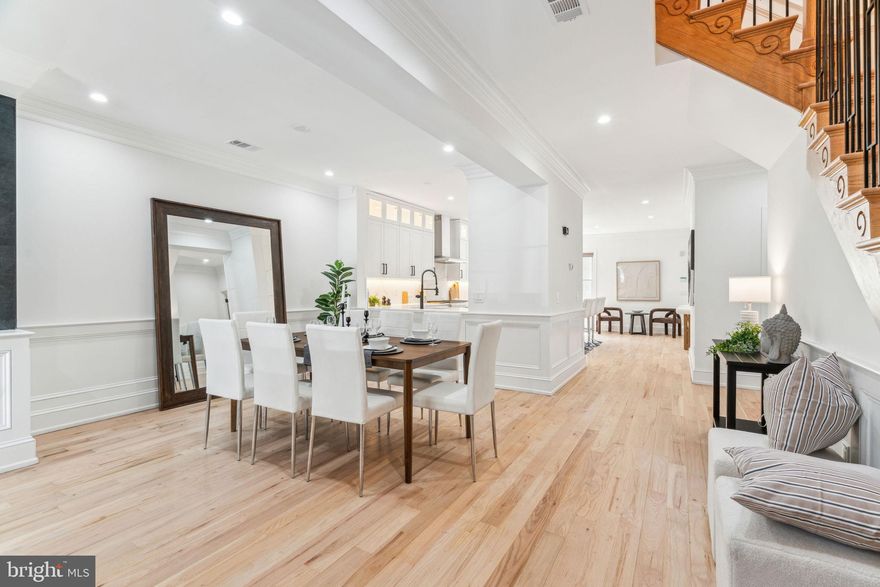 1604 Green Street is best characterized as a four-leaf clover.  Rare is the opportunity to own a home that combines plentiful space, fine finishes, a desirable location, and plentiful parking in one remarkable residence.  At 3800+ square feet of living space, this fine home has 5 bedrooms and 4.5 baths.  In other words, there is more than enough room for now, and the future.  Upon entering from Green Street, the sizeable foyer impresses as the gateway into the home while masterfully keeping the winter winds and cold at bay.  Beyond the foyer is a spacious yet well-defined open floor plan where fine materials and custom woodwork are on display along with a well-conceived lighting package.  The living room, with comfort provided by a gas fireplace, is situated next to a dining area capable of accommodating oversized dining furniture.  Further on to the newly upgraded kitchen which features a massive center island.  A natural focal point, the quartz topped island is a great gathering spot which offers casual dining space for 5.  The kitchen is distinguished by abundant shaker cabinetry, stainless steel luxury appliances and quartz countertops.  A comfortable den area is conveniently adjacent to the kitchen.  Beyond the den is a breezeway, with access to a large bluestone patio that is perfect for grilling and entertaining.  The breezeway also leads to a private, 300 sq. ft in-law suite/efficiency apt. with a private bathroom and balcony.  Finally, the breezeway extends to a spacious 2 car garage that can accommodate larger vehicles with ease.  Additionally, there is the advantage of an extra deeded parking space located directly in front of the garage in the gated and private drive, allowing suburban convenience in the midst of the city.  The home’s second floor has two bedrooms, each with plentiful closet spaces that have been customized, and private en-suite bathrooms which have been newly updated. There is also a hallway laundry closet on this level featuring new appliances.  Continuing upstairs, there is a beautiful spacious primary suite featuring over-sized closets with fine built-ins and a spa-like bathroom with a generous sized soaking tub.  An additional bedroom occupies the other end of the hall. A final set of stairs leads to a private, nicely sized roof-top deck.  Not to be missed is the additional living space afforded by the finished basement with its cozy gas fireplace. A separate room in the finished basement is well suited as an office.   All this luxury offered in a superb location within the confines of the walkable and convenient Fairmount neighborhood.