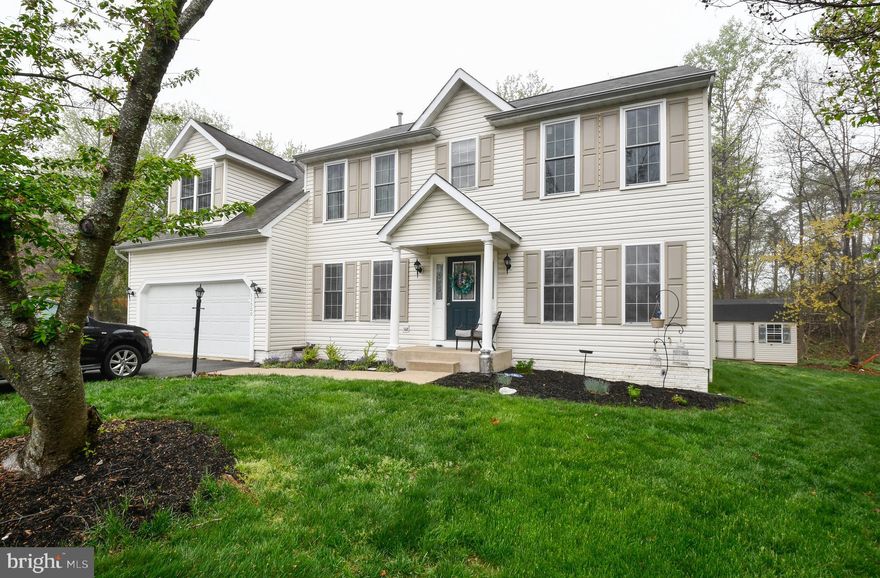 Low-traffic cul-de-sac location! This charming 4-bedroom Colonial welcomes you with a quaint portico and inviting curb appeal. Set on a beautifully maintained, level lot, routine yard service has created a lovely, lush lawn that complements the home’s inviting exterior.  Inside, you’ll find spacious rooms throughout and an easy, functional flow. The beautifully updated kitchen is a true highlight, featuring quality stainless steel appliances, a convenient pantry, and gorgeous countertops with just the right touch of sparkle. A stylish movable island provides additional seating and storage—perfect for everyday living or entertaining. Maintenance-friendly laminate flooring runs throughout the main level, complemented by freshened paint and abundant natural light.  Pretty French doors open to a large deck overlooking the backyard...ideal for relaxing or hosting gatherings—with a charming shed for extra storage.  Upstairs, you’ll find four generously sized bedrooms, all with great closet space. The full hall bath has been tastefully updated, and the convenient upstairs laundry makes daily routines a breeze. The expansive primary suite is a true retreat, offering a huge bedroom, a large walk-in closet, and a beautifully updated en suite bath. Enjoy double sinks, ample counter and storage space, a luxurious soaking tub, and a spacious shower with a high-quality hinged frameless glass door.  This home combines space, style, location, and great community amenities—don’t miss your opportunity to make it yours!