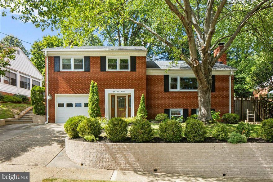 Welcome to Boulevard Manor, where modern living meets casual elegance. Perched on an elevated 6,600+ sq. ft. lot, this 3-bedroom, 3-bathroom home offers both privacy and comfort in one of the area’s most sought-after neighborhoods. From the moment you arrive, you’ll feel the sense of retreat while enjoying unbeatable proximity to parks, trails, shopping, and the city. Step inside to a welcoming foyer with a coat closet and a bright windowed den - perfect for a home office or study. A few steps up, the heart of the home awaits: a sun-drenched living room with stunning hardwood floors, a cozy wood-burning fireplace, and an effortless flow into the dining area and chef’s kitchen. The updated kitchen boasts granite countertops, a breakfast bar, and stainless-steel appliances, making it ideal for both everyday meals and entertaining. One of the home’s standout features is the three-seasons sunroom, complete with its own fireplace. From here, step out to the expansive hardscape patio with built-in seating, framed by stonework and lush, landscaped gardens - an outdoor oasis for gatherings or quiet relaxation. Upstairs you will find 3 bedrooms and 2 full bathrooms. The serene primary suite is tucked away at the rear of the house overlooking the gardens and includes a custom-shelved closet and en-suite bath. Two additional generous bedrooms face the front of the home and share a well-appointed hall bathroom and a convenient linen closet. The spacious lower level adds incredible flexibility, featuring a wet bar, a full bath, and a large laundry/storage area—perfect for hosting, hobbies, or creating a personal retreat. The attached deep one-car garage offers plenty of storage for bikes, gear, and more. Outside your door, the well-established tree lined street dead-ends into Bluemont Park, with playgrounds, ball fields, tennis and volleyball courts, and picnic areas just steps away. For commuters and explorers alike, Route 50, the W&OD trail, and two Metro stations (Ballston & East Falls Church) offer seamless and short connections to Washington, D.C. Minutes away, Seven Corners and Ballston Quarter offer an abundant selection of dining and shopping options. Blending urban convenience with suburban tranquility, this home is truly the best of both worlds.
- Roof replaced – July 2022
- Replaced Hot Water Heater
- New Stair Railings
- Replaced Refrigerator
- Replaced Washer/Dryer