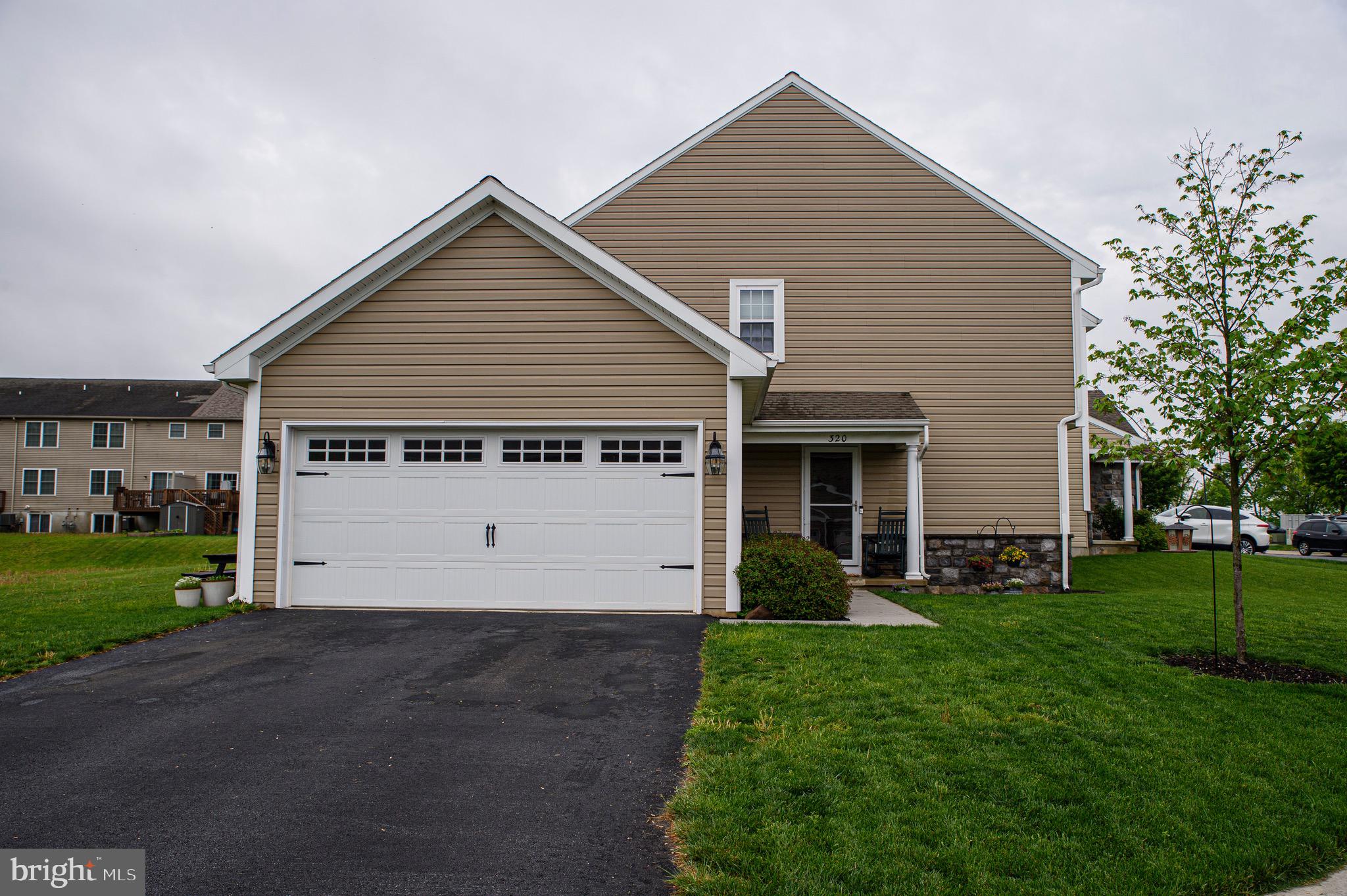 Welcome to 320 Cedar Hollow. This beautifully maintained end-unit townhome is located in the desirable Cedar Hollow community, within Manheim Central School District. Upon entering, you will immediately notice the spacious and welcoming feel created by the open-concept layout and the abundance of natural light streaming through the large living room window. The first floor features a generously sized kitchen with a convenient eat-in island and stainless steel appliances — perfect for cooking and gathering. A convenient half bath and a laundry room with garage access add functionality and ease to accommodate a busy lifestyle. Upstairs, the large owner's suite includes a full private bathroom, complemented by two additional well-sized bedrooms and a second full bath. Don't miss the fully finished basement, complete with a custom-built bar — ideal for entertaining guests or enjoying a quiet night in. Schedule your showing today and make this wonderful home yours!