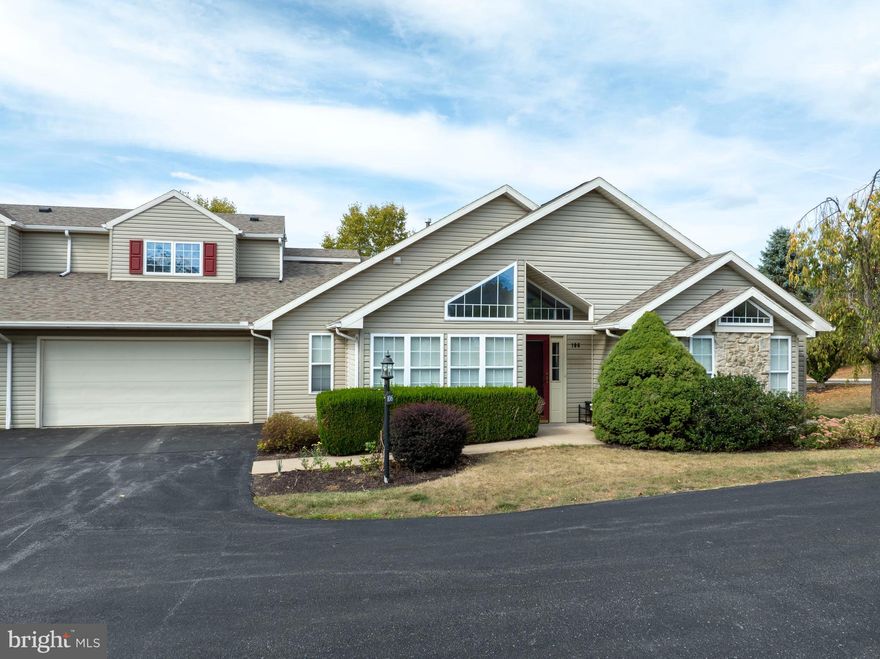 Looking for low maintenance, one-floor living? Then come visit the clubhouse community of Wellington Greens. This condo is an amazing Penn State neighborhood, just off South Atherton Street where you can enjoy dining, entertainment, and shopping in State College, Boalsburg or a short drive to Historic Bellefonte.   From the curb you can see this home shines with natural light from its numerous tall and transom windows showcased in the vaulted and cathedral ceilings.  The stone accented front welcomes you into the foyer that flows into a large great room with natural gas fireplace.  Here you will also find a door to the patio for morning coffee or evening sunsets.  Back inside, the galley kitchen features an open large bartop  so that you can chat with friends and  family while cooking dinners.  The kitchen has lots of storage, gas range, double sink and tile flooring.  There is built-in cabinetry for even more storage in the dining area, which is adjacent to a beautiful sunroom. But this sprawling 1st floor doesn't stop there...you also have a half bathroom for guests, 1st floor laundry and a oversized primary suite.  The primary suite is the size of two bedrooms so you can have a home office or home gym just a step away.  There are also dual walk-in closets and a luxury bathroom with soaking tub, shower, and oversized vanity with tile flooring.  Head to the 2nd floor which hosts one large bedroom and 2nd attached full bathroom. This space allows for ultimate privacy and is helpful for multigenerational living. Lastly, the monthly condo dues make budgeting a breeze since it includes your water, sewer, trash/recycling pick up, lawn maintenance, pest control, snow removal, basic cable, and access to the clubhouse and community's outdoor swimming pool. So whether you want to live here full-time or part-time,  come check out this great home!