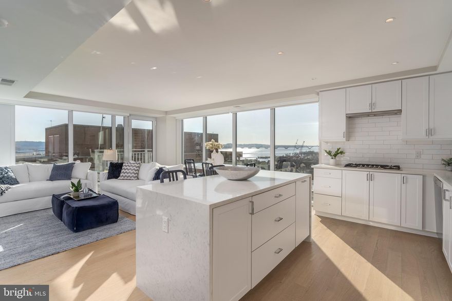 This corner Venue unit features both southern and eastern exposures, large windows and views of the Potomac River.   Three bedrooms PLUS a den and 2.5 bathrooms and 1,760 square feet.  Enter through a  foyer that opens into the open plan living/dining and kitchen area. The primary bedroom suite is a retreat in itself, complete with a generous walk-in closet and a spa-inspired bath. The den works well as an office, TV room or yoga studio.  . Practically NEW, this condo ensures modern comfort and convenience. Other highlights of the unit include TWO parking spaces, recessed lighting, modern fixtures and more. World-class amenities include a concierge, modern lobby area, fully equipped fitness center, and a rooftop oasis with an outdoor kitchen, lounge area and clubroom with bar. The location is unbeatable: just a block to the waterfront,  and located in the new Arts district in Old Town;  close to vibrant King Street with its local shops and restaurants and just a short drive to Potomac Yard, National Landing, Amazon's new HQ2, National Harbor Reagan National Airport. and Washington DC.  Commuting is a breeze with Braddock Road Metro only 0.9 miles away.   Convenient  to major commuting routes.