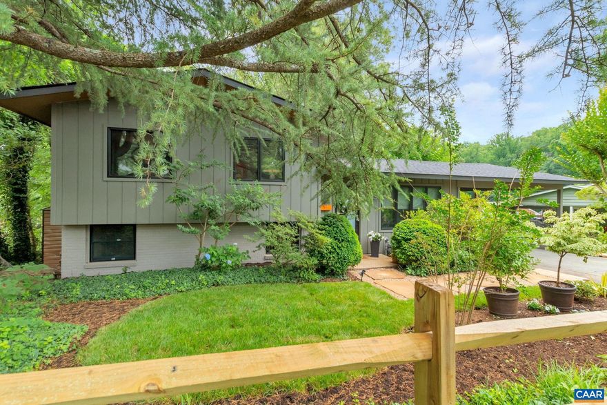 Reminiscent of a California bungalow with modern lines and large roof overhangs, this home is renovated from top to bottom with high-end finishes and new major systems by a renowned interior designer. A recent remodel included a new roof, Anderson windows + doors, a gorgeous kitchen, stunning bathrooms, flooring, electrical, plumbing, spray foam insulation, interior + exterior paint, and sewer line replacement. The sophisticated kitchen features custom cabinetry, quartz countertops, a porcelain sink, and Fisher & Paykel appliances. The waterfall quartz island is the centerpiece of the open concept space, which connects the sitting and living areas with a great flow for easy living and entertaining. Stunning tile work creates a spa-like setting in each of the 3 full bathrooms, the largest of which is attached to the primary bedroom and features reclaimed Morrocan tile. A bonus space on the terrace level could serve as a den, office space, or an extra bedroom/in-law suite. The attention to detail continues to the exterior with updates to the carport, extensive landscaping, and a patio with a built-in fire pit. The large backyard is a private oasis! This location is convenient to local parks, UVA, downtown, and Southside shopping.,Quartz Counter,Wood Cabinets
