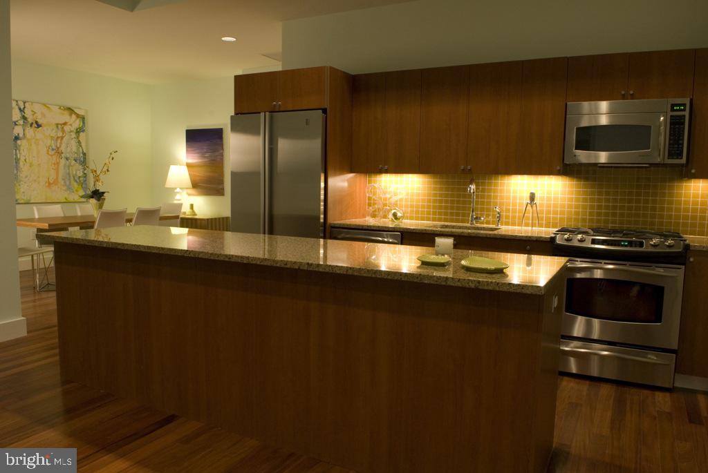 Huge light filled one bedroom plus den. South facing, 14 ft ceilings, lots of room, gas cooking in a luxury doorman building. Parking for a sedan license 25,000 or 70,000 for a suv license has 250/mo monthly fee. One storage unit included on the third floor.