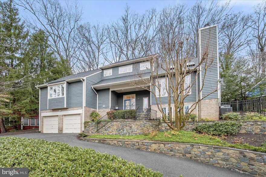 Stunning renovated contemporary with soaring ceilings, spacious rooms, beautiful light and views steps to the MacArthur walking and  bike path, minutes from Cabin John restaurants and shops, the Canal Towpath, and in the Carderock/Pyle/Whitman district! A hiking and biking paradise! Beautiful hardscape and landscaping welcome you. The wonderful floor plan includes a warm living room/great room with gorgeous stone fireplace and wood floors with french doors open to the rear entertaining sized patio. You feel like you are on vacation at home! The  space is open to the dining room and flows beautifully to the lovely kitchen with island open to the family room with second fireplace and tree top views. The kitchen leads out to lovely patio with room to dine "al fresco" and grill--this adjoins a more expansive patio with great flow for parties!  Powder room. A first floor primary bedroom suite includes a luxurious, spa-like renovated bath with soaking tub (oh the views!) and separate oversized shower.  Ample closets. The primary suite has a  private 3 season room retreat and an office.  Upstairs find 3 very large bedrooms, massive amounts of closets and storage and 2 renovated baths.  The lower level has a daylight family room/recreation room with great light (south facing) and plenty of room for a TV/media space plus game room! Large utility storage room with laundry. 2 car garage is impeccable! EZ commute with multiple routes to DC, NoVA, 270 corridor. Potomac Village with restaurants, 2 groceries,  gourmet and fish markets, hardware, convenience and more is about 8 minutes away. Parks, trails, golf galore, several community pools you can join are nearby. Lovely neighborhood of 20 plus houses where everybody knows your name.