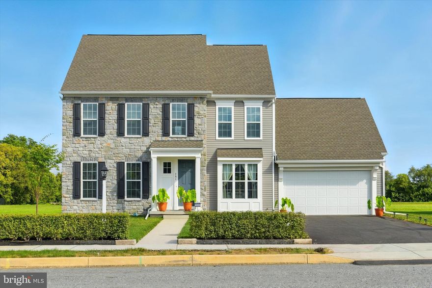 Welcome to this stunning home in the desirable Tattersall community! A charming covered front porch sets the tone before stepping inside to a bright foyer with luxury vinyl plank flooring that flows throughout much of the main level. The formal dining room offers the perfect space for entertaining, while the eat-in kitchen is a chef’s dream with granite countertops, tile backsplash, stainless steel appliances, soft-close cabinetry, an island, and a spacious pantry. The main level primary suite is a true retreat, featuring a large walk-in closet and a luxurious attached bath with a double vanity, soaking tub, and full tile shower. Additional highlights of the main floor include a convenient mudroom and laundry room with utility sink and built-in cabinets. Upstairs, you’ll find a versatile loft space, two additional spacious bedrooms, and a full bath. The full unfinished basement offers endless possibilities for storage or future living space. Attached three car tandem garage for ample parking. Step outside to enjoy the private, level lot with a gas line hook-up—perfect for outdoor entertaining. Sidewalks and streetlights throughout the community make it easy to enjoy peaceful evening walks. Conveniently located to shopping, dining and entertainment. A joy to own!