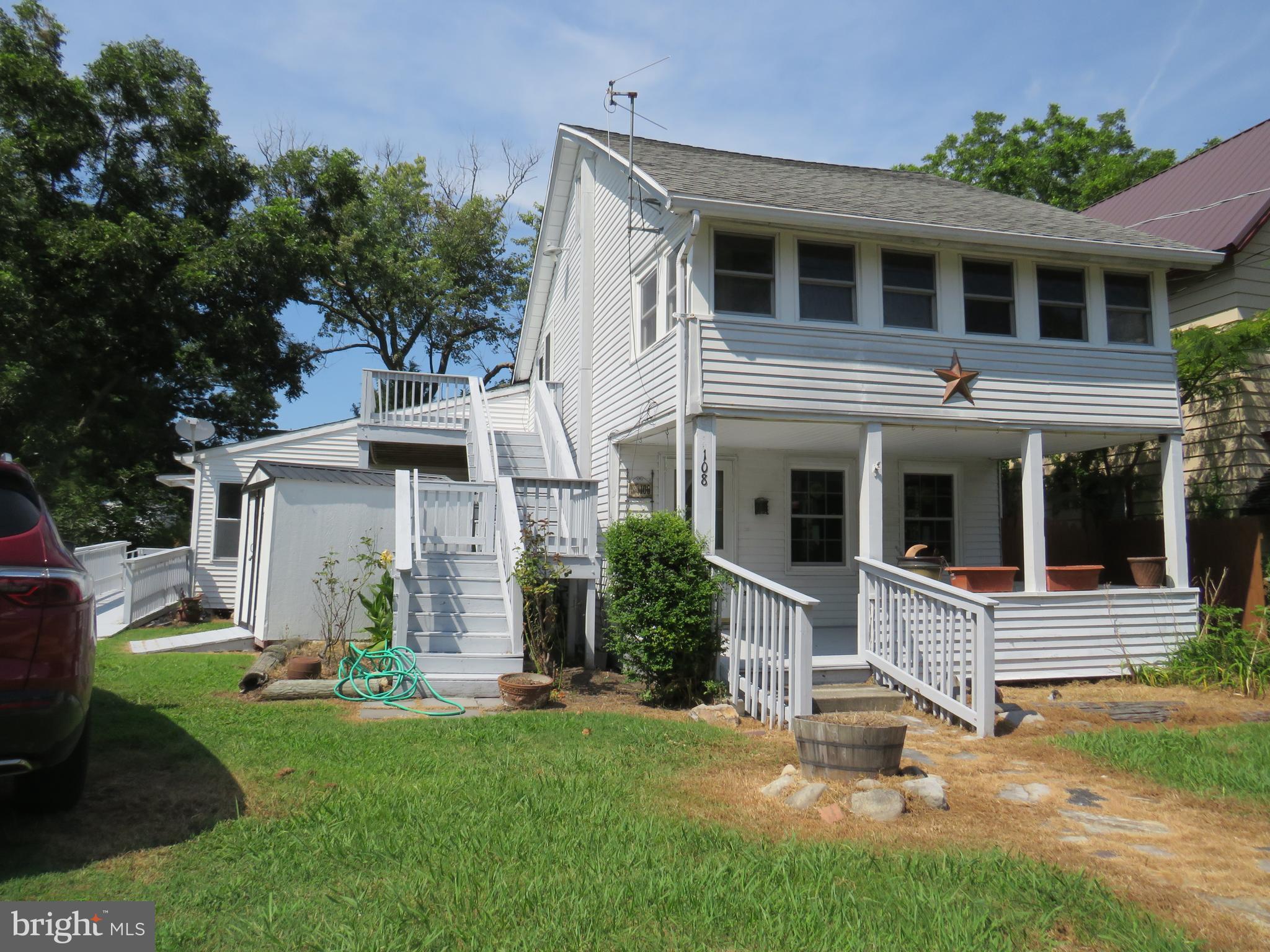 Charming home with many unique features. Large family/living room with lots of light adjoins modern kitchen. Full bathroom on first floor and second floor. Two bedrooms on second level with a sleeping porch for additional space. (accessed through bathroom) Outside staircase to second floor lends itself to other possibilities. New 12'x20' shed with electric service, and small utility shed. Large lot has garden features at the rear, with a deck to enjoy evenings and morning coffee! Front porch for evening sits and watching the world pass by. Located in the Arts and Entertainment District, walking distance to shopping, the marina, and local restaurants. New Pella replacement windows just installed to replace older wooden windows. So many possibilities!