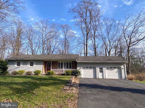 One floor living at its best! Extremely well maintained ranch home located in a wooded setting with no neighbors to the front or the back. This home has lots of room for entertaining inside in the large finished rec room with brick fireplace and woodstove or outdoors in the level back yard, patio area with firepit or the cozy covered porch. Properties in this neighborhood don't come on the market very often. Call today before its gone!