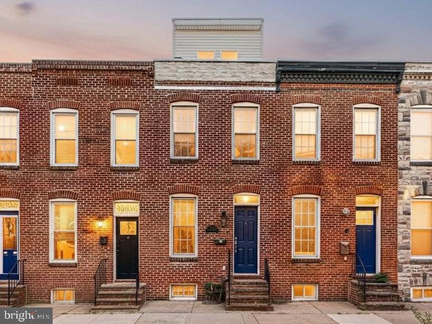 This spacious renovated home offers 4 finished levels, rare 2-car parking, and a rooftop deck perfect for enjoying your early morning coffee or unwinding at the end of the day. Sitting on a deep lot, this home is more spacious than many in the neighborhood. The main level has an open living room, dining room, updated kitchen, and powder room with a walkout to the rear parking pad. Upstairs, the 2nd  floor has two bedrooms (both with great closet space), a full bath, and a laundry room in the hallway. The 3rd floor offers a private bedroom suite with an updated full bath with jetted tub, wet bar, and direct access to the rooftop deck—perfect for entertaining. The finished basement provides flexible space for a home office, gym, or additional living area, plus plenty of storage. A unique combination of space, parking, and outdoor living, all in a prime Federal Hill location close to parks, dining, and  all the Federal Hill area has to offer.