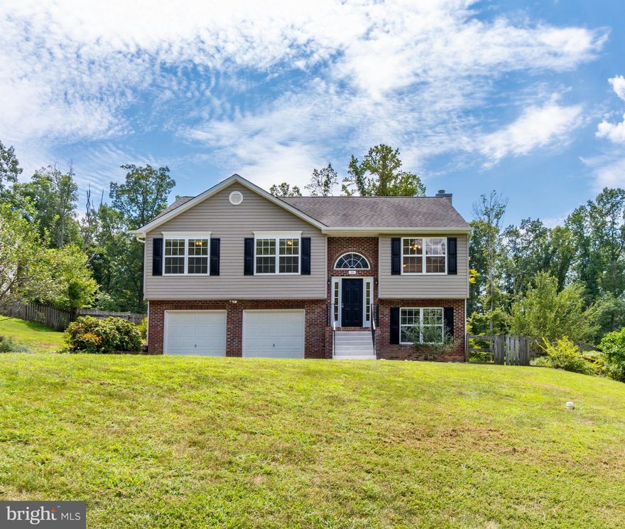 Do You Like Quiet Living with a Country Feel, but Close to Everything? Then this Charming Home with Lake Views on .46 acres is for You! This Beauty Features Extensive Hardwood Floors, Wood Steps, Fresh Neutral Paint, Lovely Millwork, Vaulted Ceiling and Gas Fireplace. The Upper Level Boasts a Sunny Kitchen with Plenty of Cabinet Space, Pantry and Tile Backsplash. The Master Bedroom Suite has a Spacious Walk-in Closet and Attached Bath with Ceramic Tile and Double Sinks. There are two Additional Bedrooms and a Full Bath. Enjoy the Bright and Open Living and Dining Rooms Right Off the Kitchen. Step Outside to the Spacious 12 x 16 Deck for Summer BBQs and Peaceful Relaxation. Enjoy Additional Living Space on the Lower Level with a Recreational Room with Gas Fireplace and Flex Room for Guest Bedroom or Office and Half Bath. Plenty of Parking with a Two Car Garage and Long Driveway. The Rear Yard is Fenced for a Dog Friendly Experience and Gardening! Hidden Lake Community has Pavilion and Private Lake with Beach. Just a Small walk to Swimming, Fishing, and Canoeing. Optional HOA.