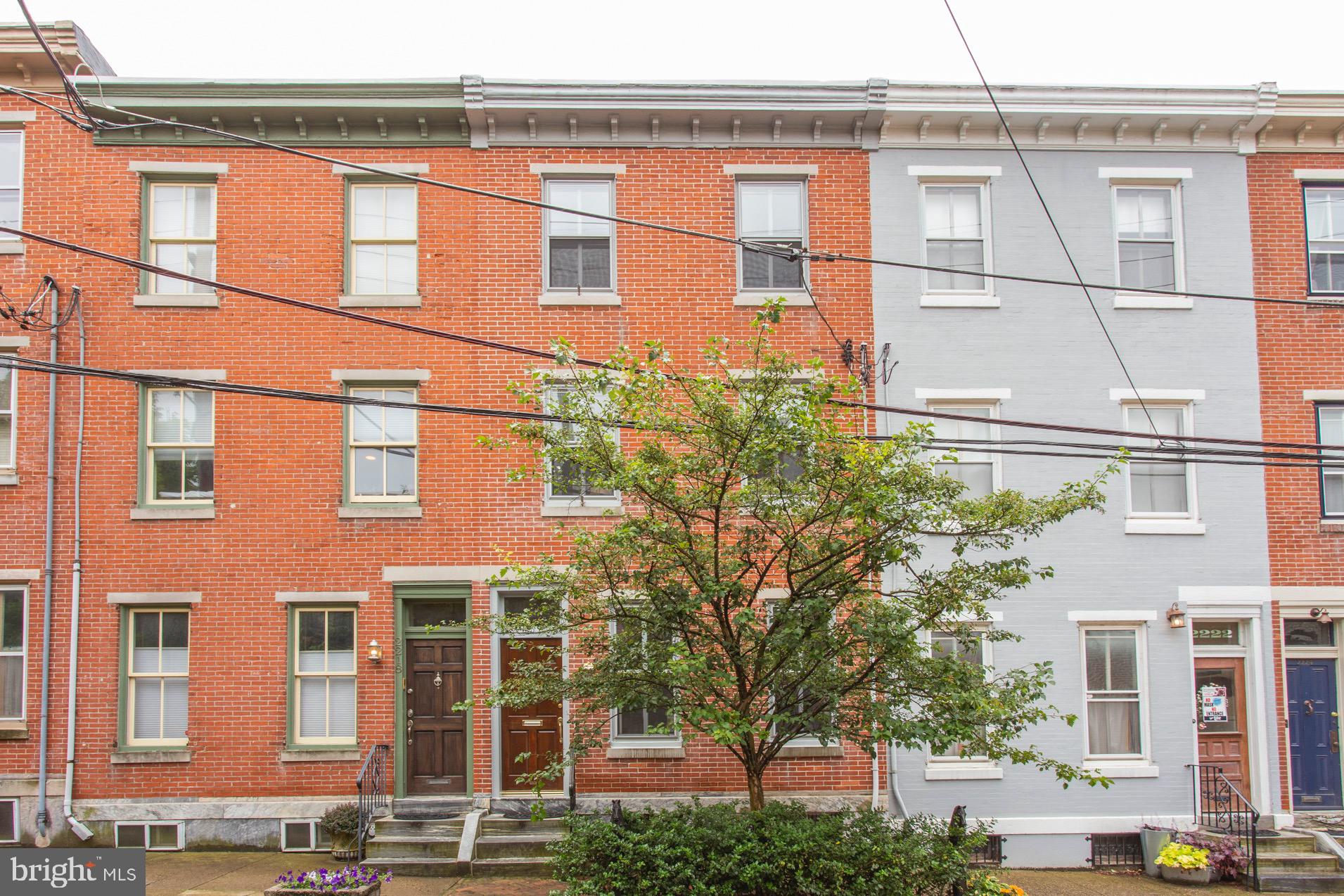Excellent condition, clean lined 4 bedroom, 2 full bath, 2 half bath brick Townhouse on a most desirable Spring Garden block.  Inviting, elegant yet casual first floor living space with exceptionally good scale.   Sensible, flexible  plan with bright bedrooms  and great work at home options.  True well maintained quality renovation with attention to detail, lovely millwork details,  wide board pine flooring , and high ceilings throughout.   Rear brick patio  steps from kitchen and spectacular roof deck!  Entry vestibule with double transoms to open living room with beautiful original wood stair to 3rd floor, original marble mantle and front window lower panel millwork,  crown molding, pine floor.   Attractive powder room.  Gracious dining room with 2 side windows, crown molding, pine floor, and coat closet.  Handsome  eat-in kitchen has gas range with overhead exterior venting,  painted wood cabinetry, granite counters, subway tile backsplash, recessed and task lighting, tile floor,  room for table and chairs with removal of free standing  wood block  island,  door to steps to rear patio.  The second floor has a really great layout:  front primary  bedroom suite has  bedroom with pine floor + 8 x 8 custom walk-in dressing closet + great  tile  bath with big stall shower and a  wide vanity sink and storage cabinet,   lovely rear  bedroom with 2 closets and neutral carpeting,  great looking light/bright hall tile bath with shower over tub/pedestal sink/shelved closet,  appealing laundry room with large window and big shelved  closet.   Third floor:  front bedroom with pine floor,  hall with closet and stair landing with big window,  rear  bedroom  with pine floor and glass door to amazing roof deck.     Fantastic finished  basement  family room perfect for media/yoga/gym/home office; 2nd powder room;  big rear storage room with utility sink, side mechanical room.  Central air conditioning and gas heat.  200 Amp electric with newer wiring.  Fenced rear brick patio with garden is steps from kitchen and perfect for grilling, relaxing, entertaining.  Rear storage shed for bikes and garden tools.  The well engineered roof deck is a breathtaking escape with open air, big sky and city views.   Located close to the vibrancy of the museum district with fantastic shopping, restaurants, coffee shops.  Minutes to center city, the tranquil green of Fairmount Park/Kelly Drive/The Schuylkill River Trail, and major roads.