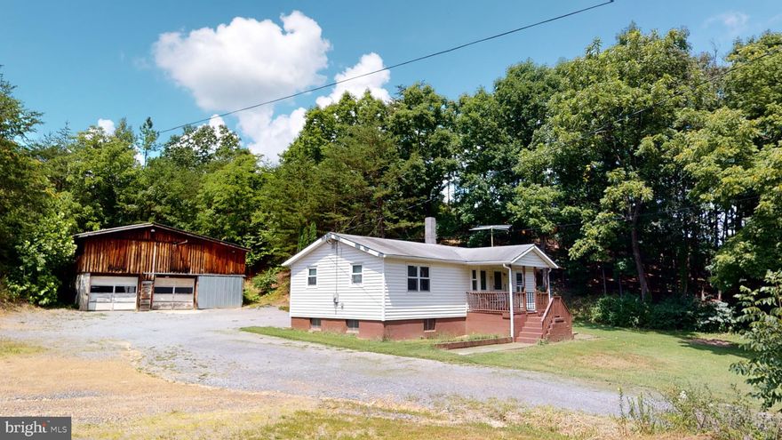 Down the country road lies this sweet little starter home or the perfect place to downsize! Hardwood Floors and Bowed Front Windows add to the Charm of the interior. This quaint Kitchen has wooden cabinets and is open to the Dining Room  with ample seating space. Full unfinished basement. Enjoy Mountain Views from the large windows in the living room or sit on the Covered Front Porch and Enjoy the Sounds of Nature.  A Large 2 Story Heated Garage sits on the property with 3 Parking Spaces and plenty of Storage or room for a  Workshop! This is a perfect opportunity to own a home and stop the rent payments.  Call us today for a showing! Click the Camera Icon to take a Virtual Tour!  Shop/Garage/Paint Room located next to the property can be purchased.  Perfect opportunity to be your own boss and work from home.  Check out this business opportunity for 4147 Sperrys Run.