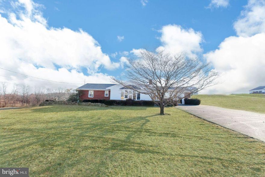 Beautifully updated rancher surrounded by views of farmland.   This home has been fully updated and is ready to move right in to.  Step into the living room and check out the view from the big bow window!  On those chilly nights there's even a brick fireplace waiting to warm you up.  The brand new kitchen with white cabinets and white countertops has lots of space to move around in and has a big dining area, plus all of the new appliances convey for the lucky buyer.  The family room can also be easily become another bedroom if desired and there are 3 more bedrooms too!  The fabulous brick walled sunroom, will steal your heart.  The lower level rec room has lots of space where you can section it off into a play room, office, game room, whatever your heart desires.  There is even a 2nd full bath for added convenience.  The big storage area will also come in handy.  Outback the carport is partially screen in and can be used as additional living space.  This leads to the fenced in inground pool and patio area.  Beyond this area is a big 30 x 36 Morton Pole building with electric and 2 overhead 8' high x 9.9 wide doors.  In addition to all of this, this home offers you peace of mind with all new windows, a new roof and new HVAC system.  This one is just waiting for you to call it home!